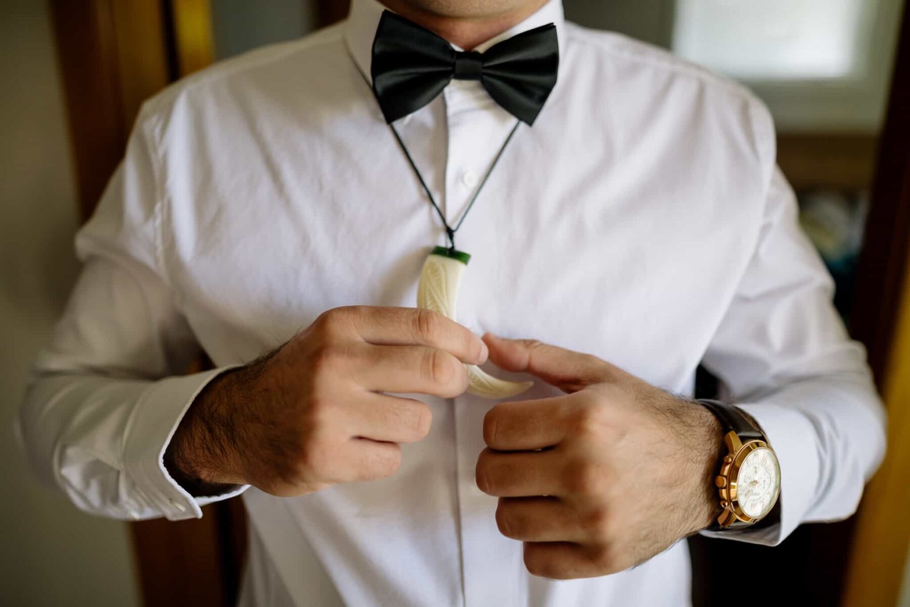 hipster groom with horn pendant necklace