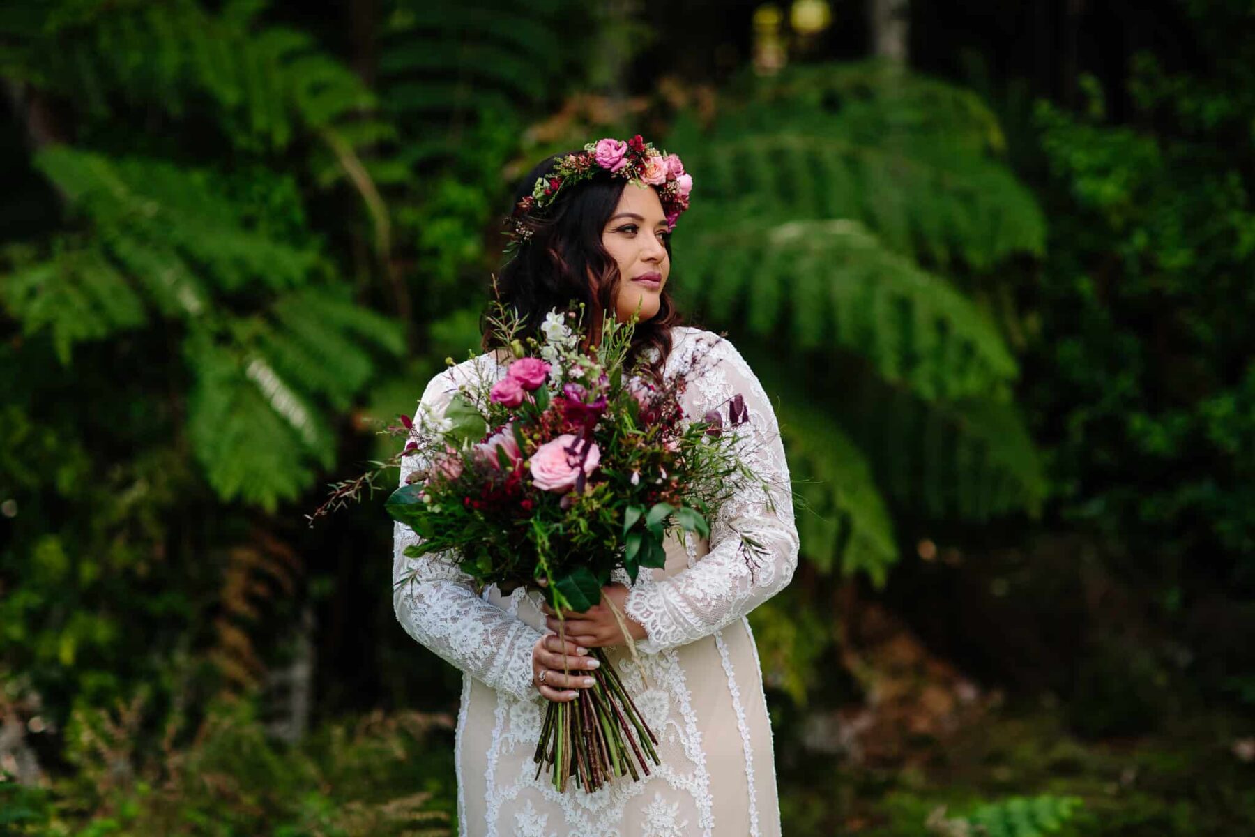 boho bride with pink bouquet and flower crown