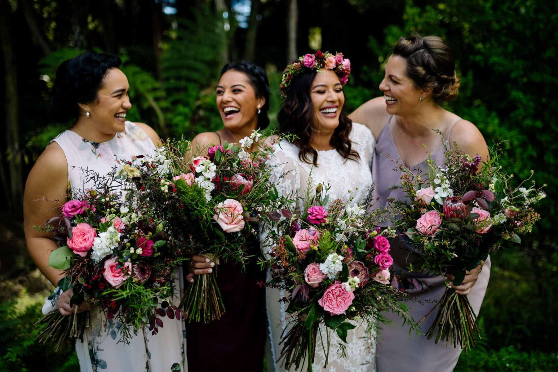 mismatched bridesmaid dresses with pink bouquets