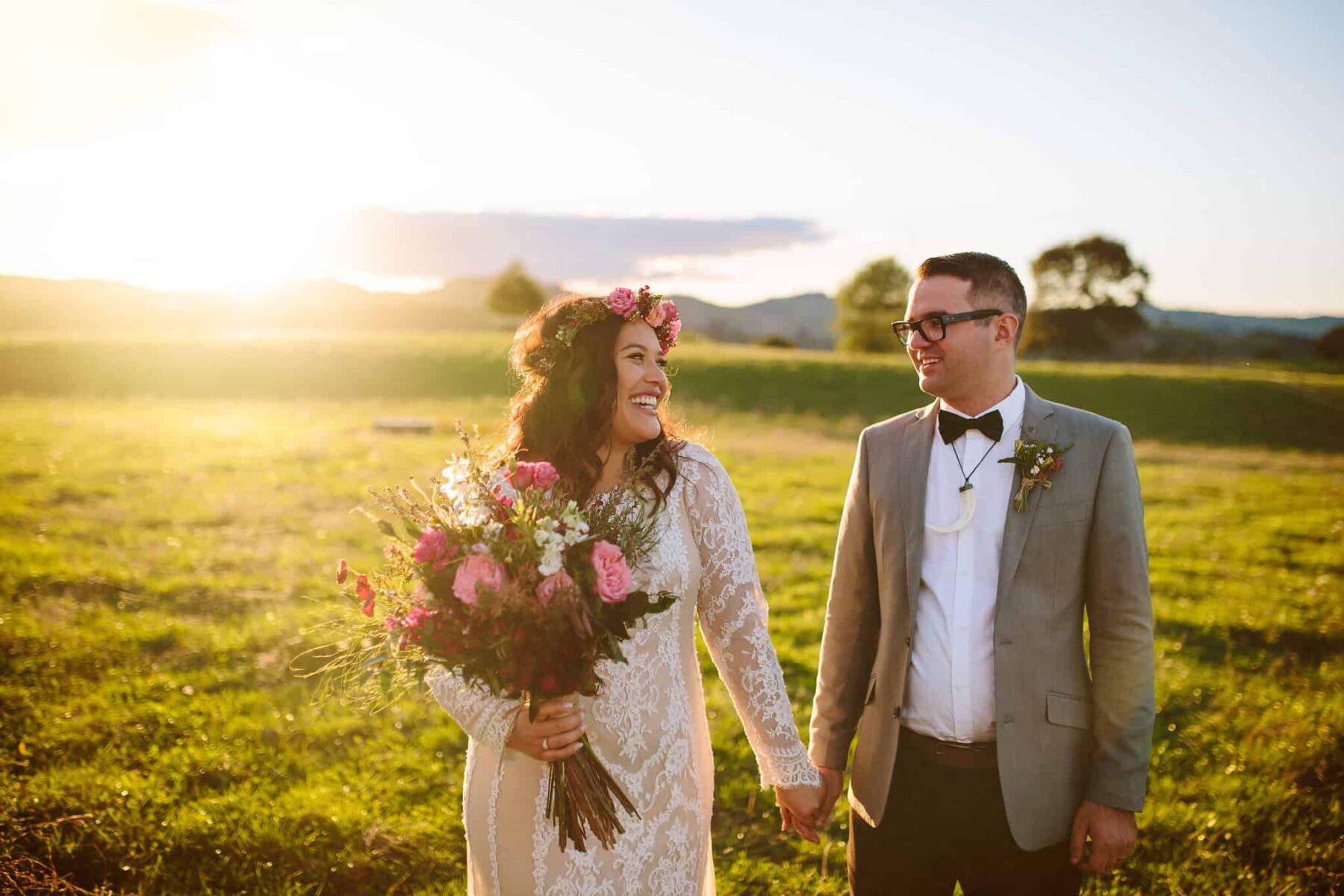 boho bride with pink bouquet and flower crown