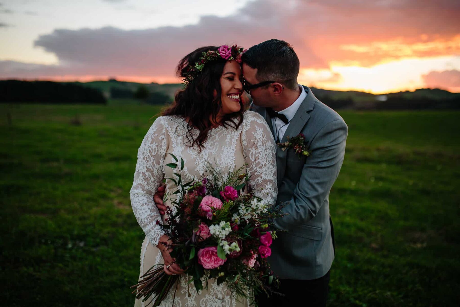 boho bride with pink bouquet and flower crown