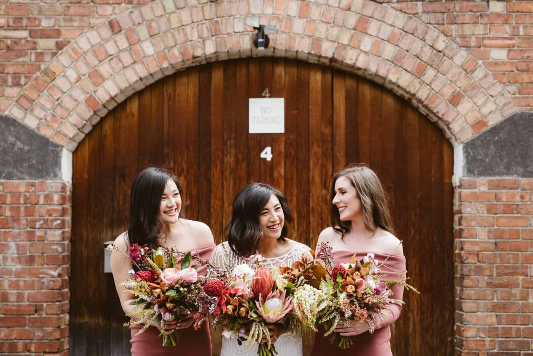 blush and dusty pink bouquets with king proteas and native flowers