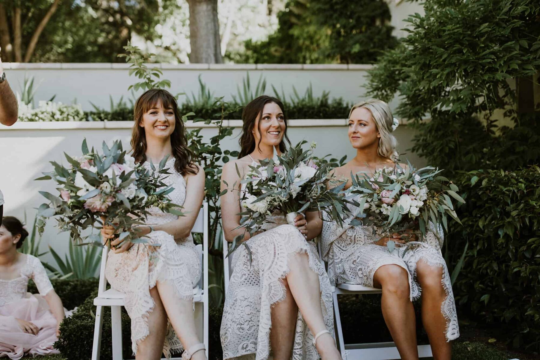 boho bridesmaids in white lace dresses