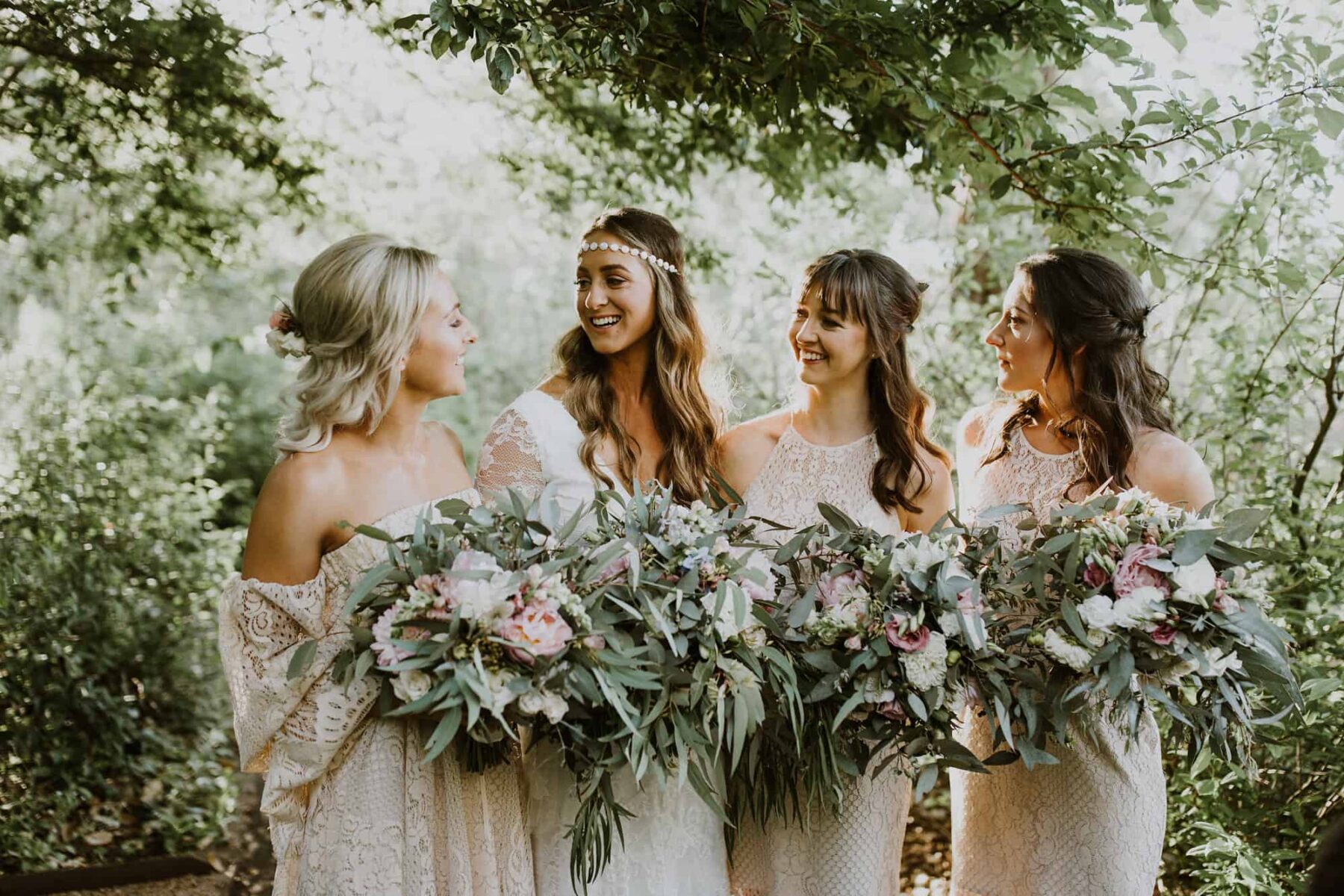 boho bride and bridesmaids in white lace dresses