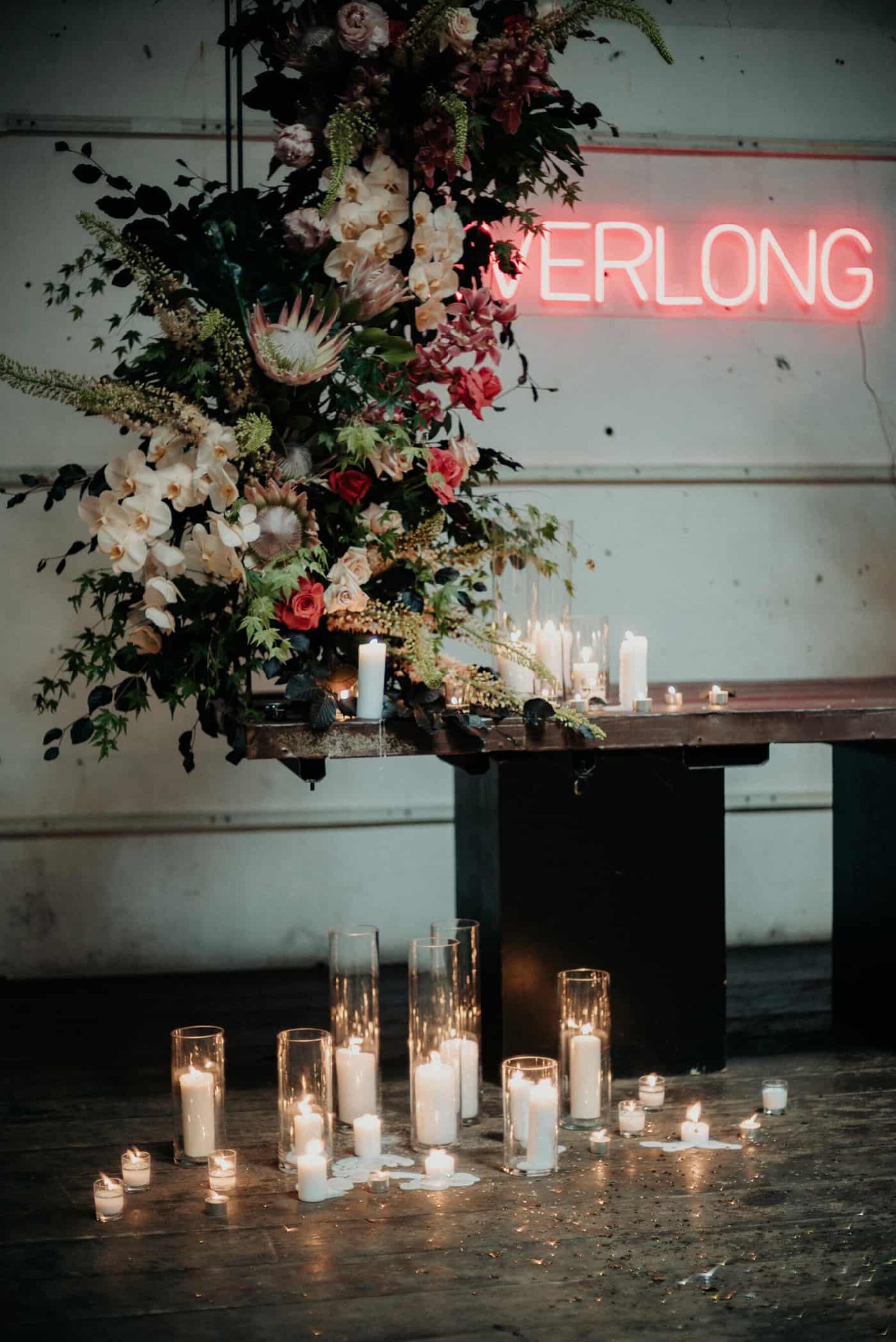 industrial wedding with neon 'Everlong' sign