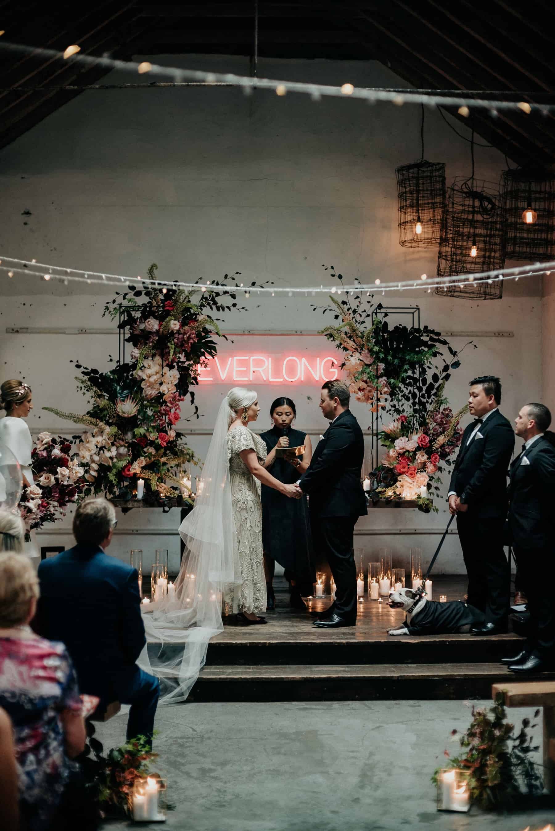 industrial wedding with neon 'Everlong' sign