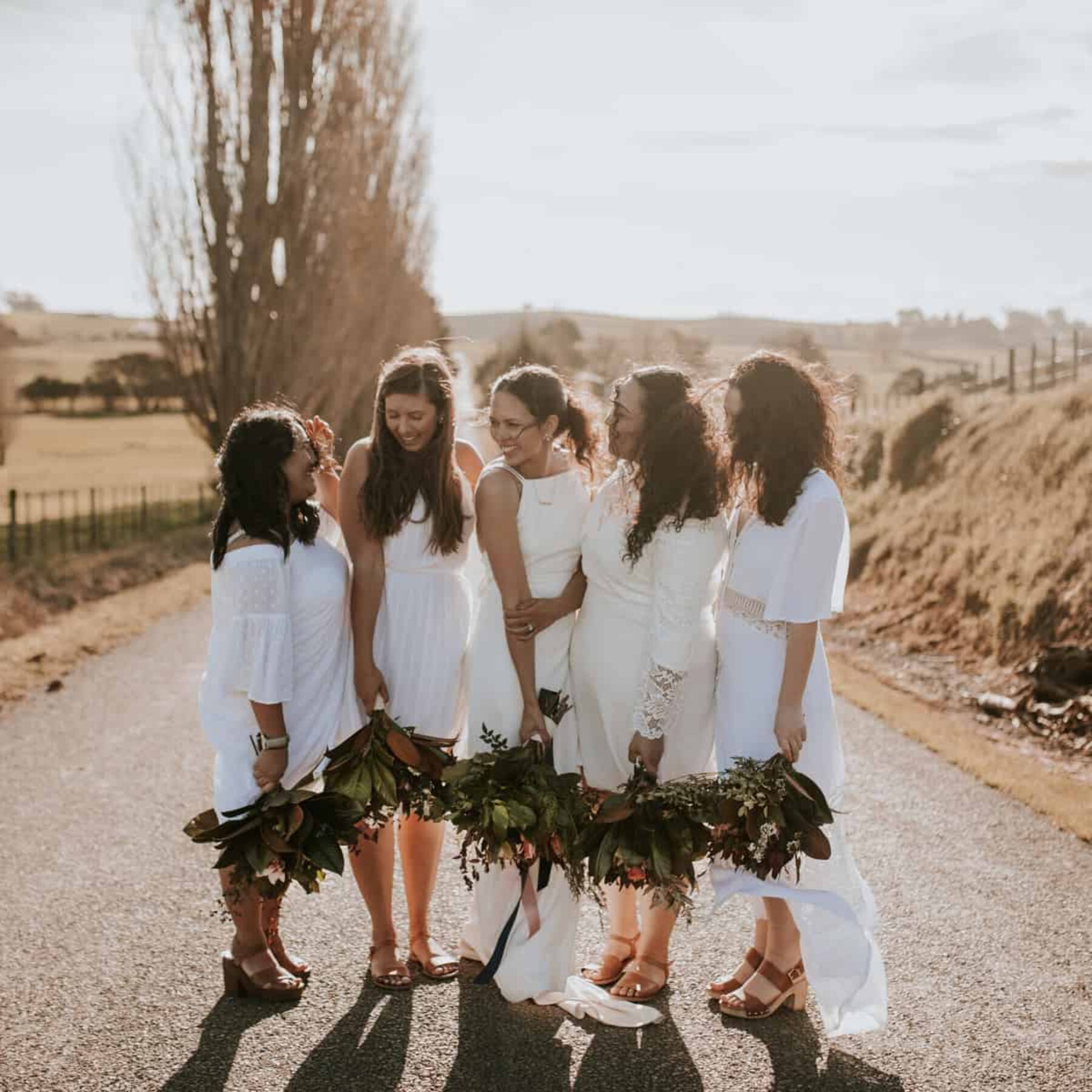 bridesmaids in mixed white dresses
