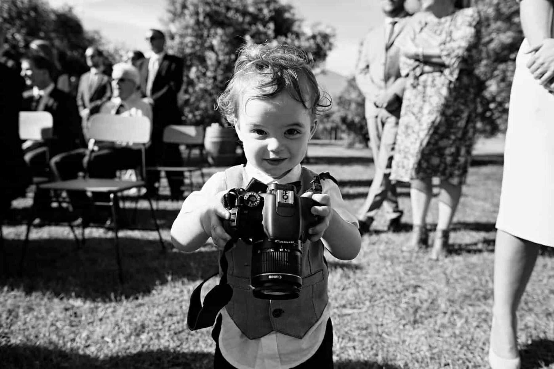toddler with SLR camera