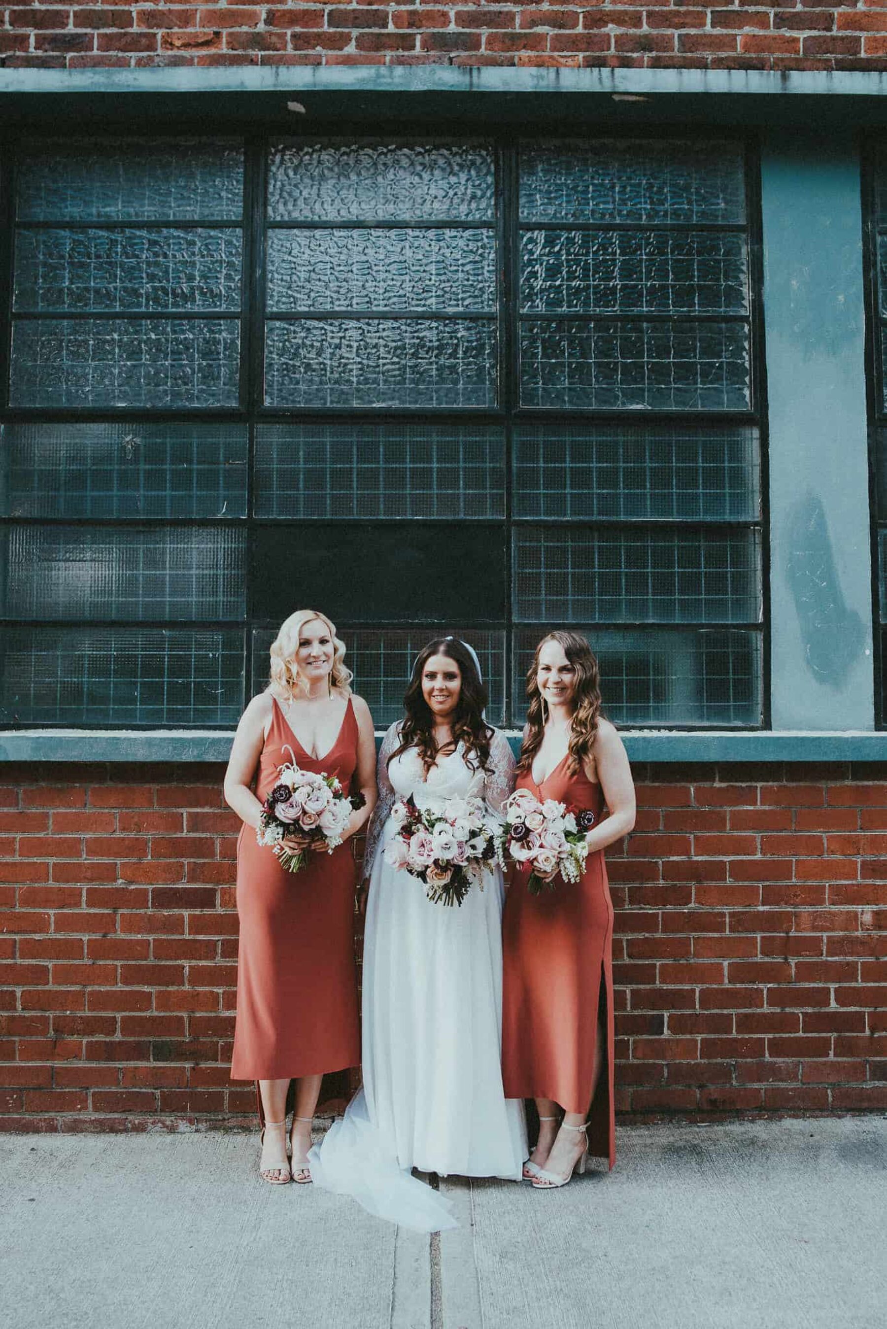 terracotta-toned bridesmaid dresses by Natalie Rolt