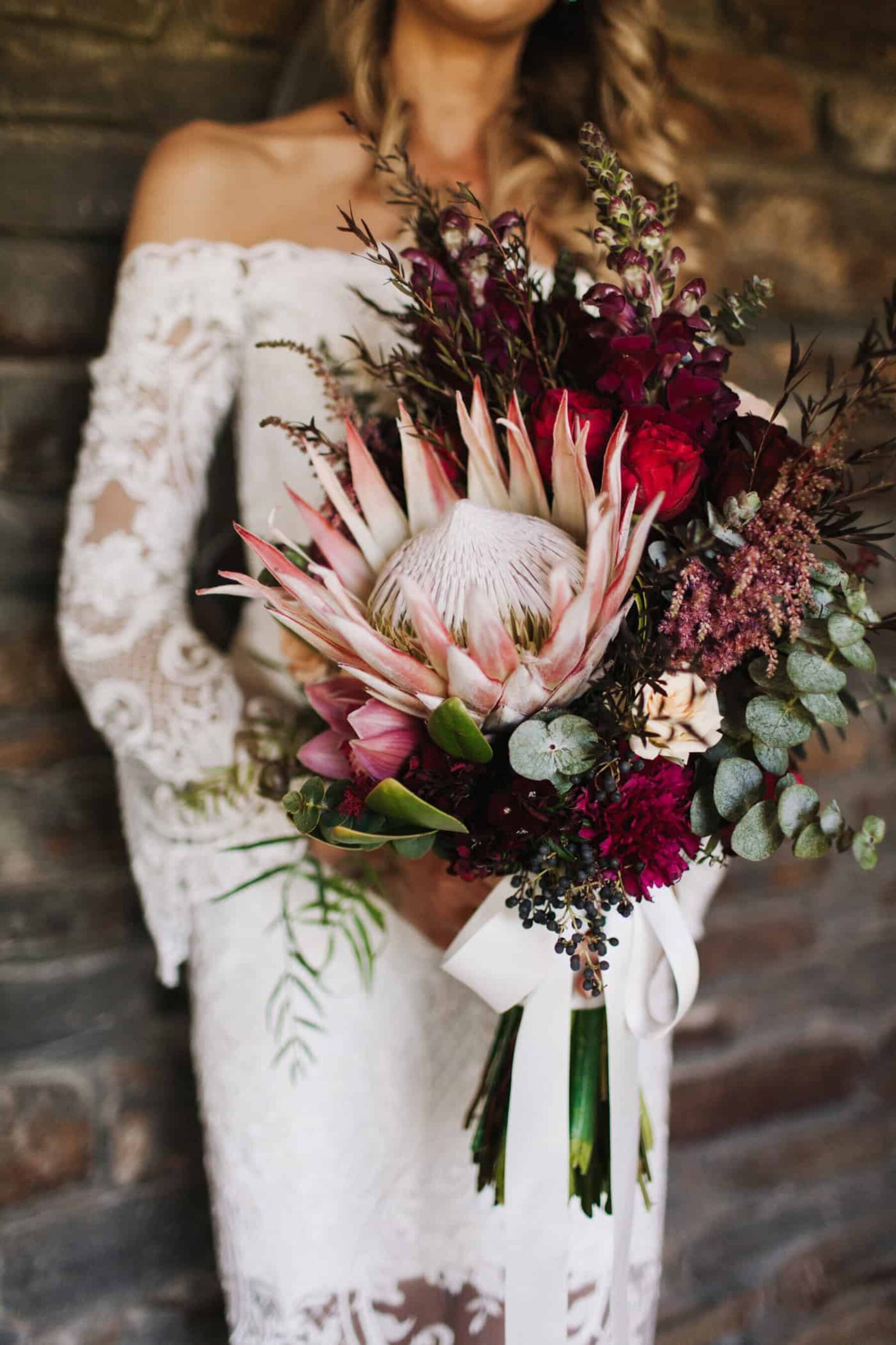 blush and burgundy bouquet with giant king protea