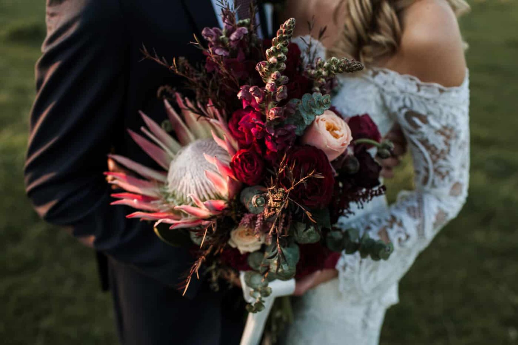 blush and burgundy bouquet with giant king protea