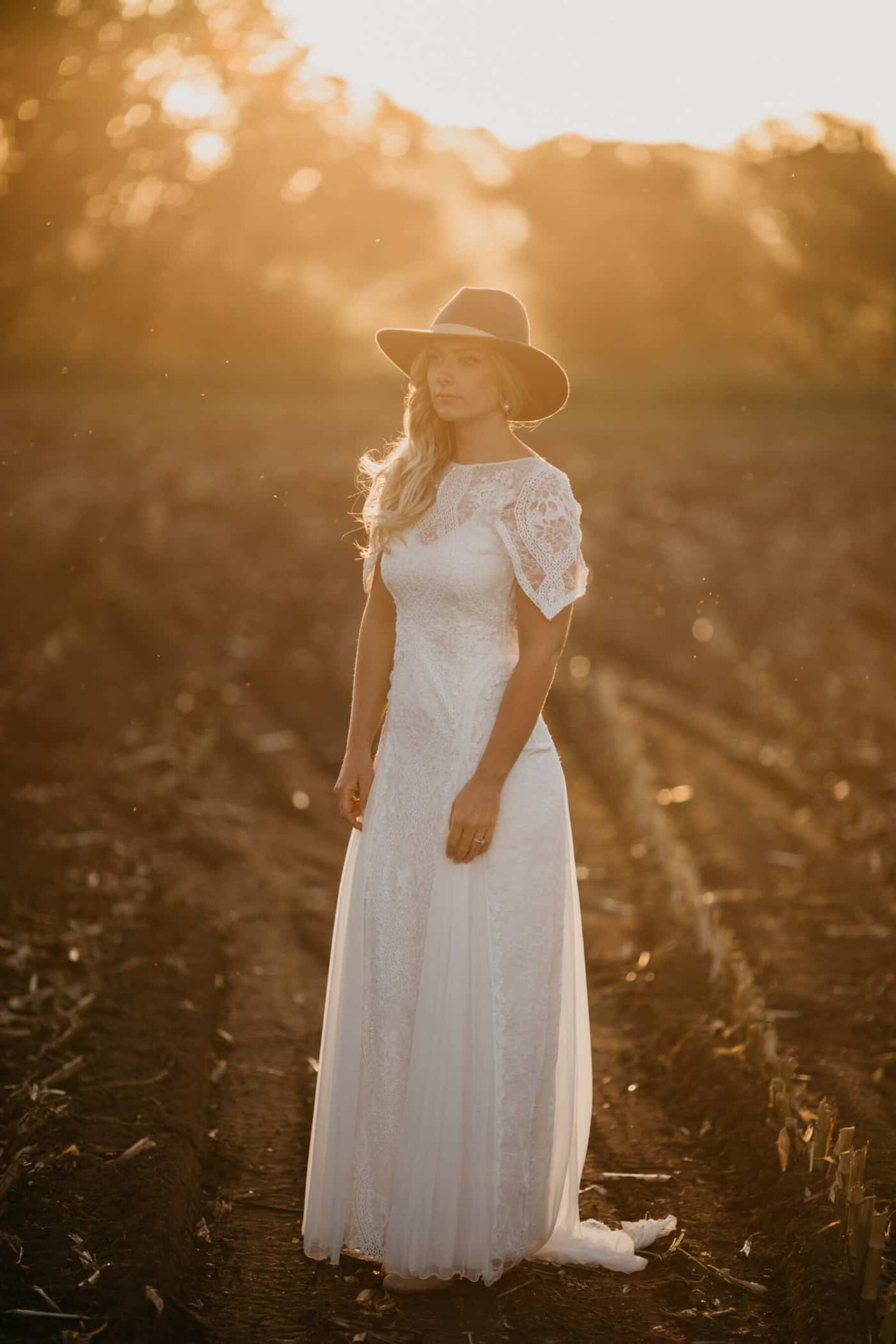boho bride in Grace Loves Lace gown and fedora hat