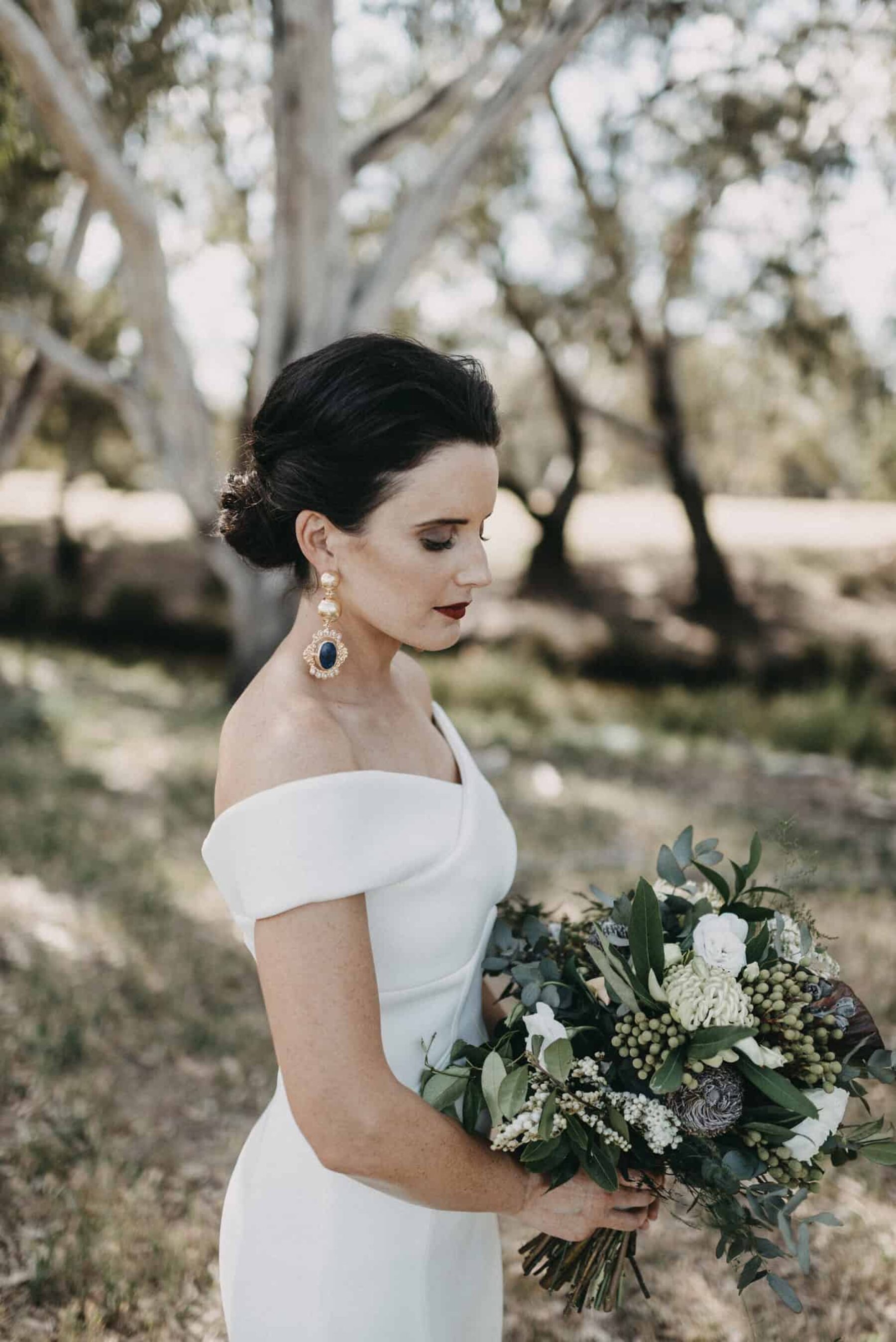 modern bride in off-shoulder wedding dress by Rachel Gilbert