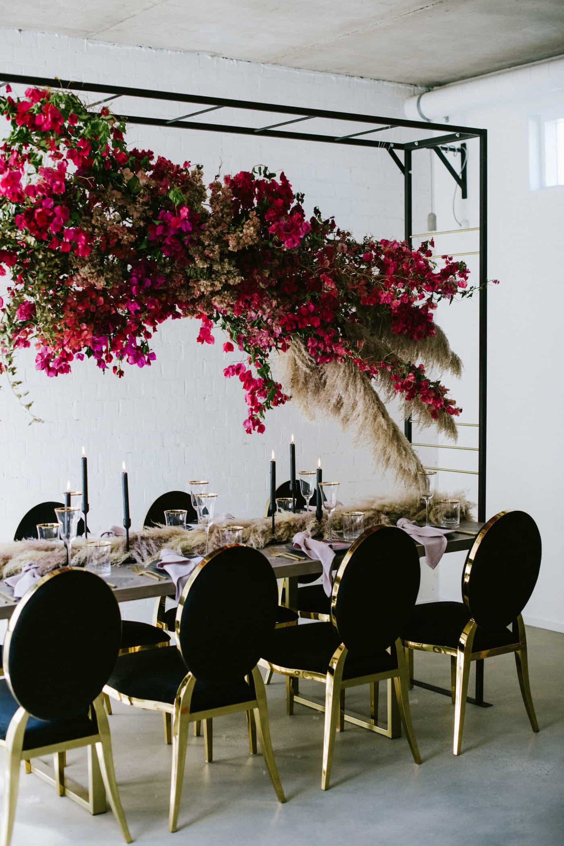 bougainvillea hanging floral installation over modern tablescape