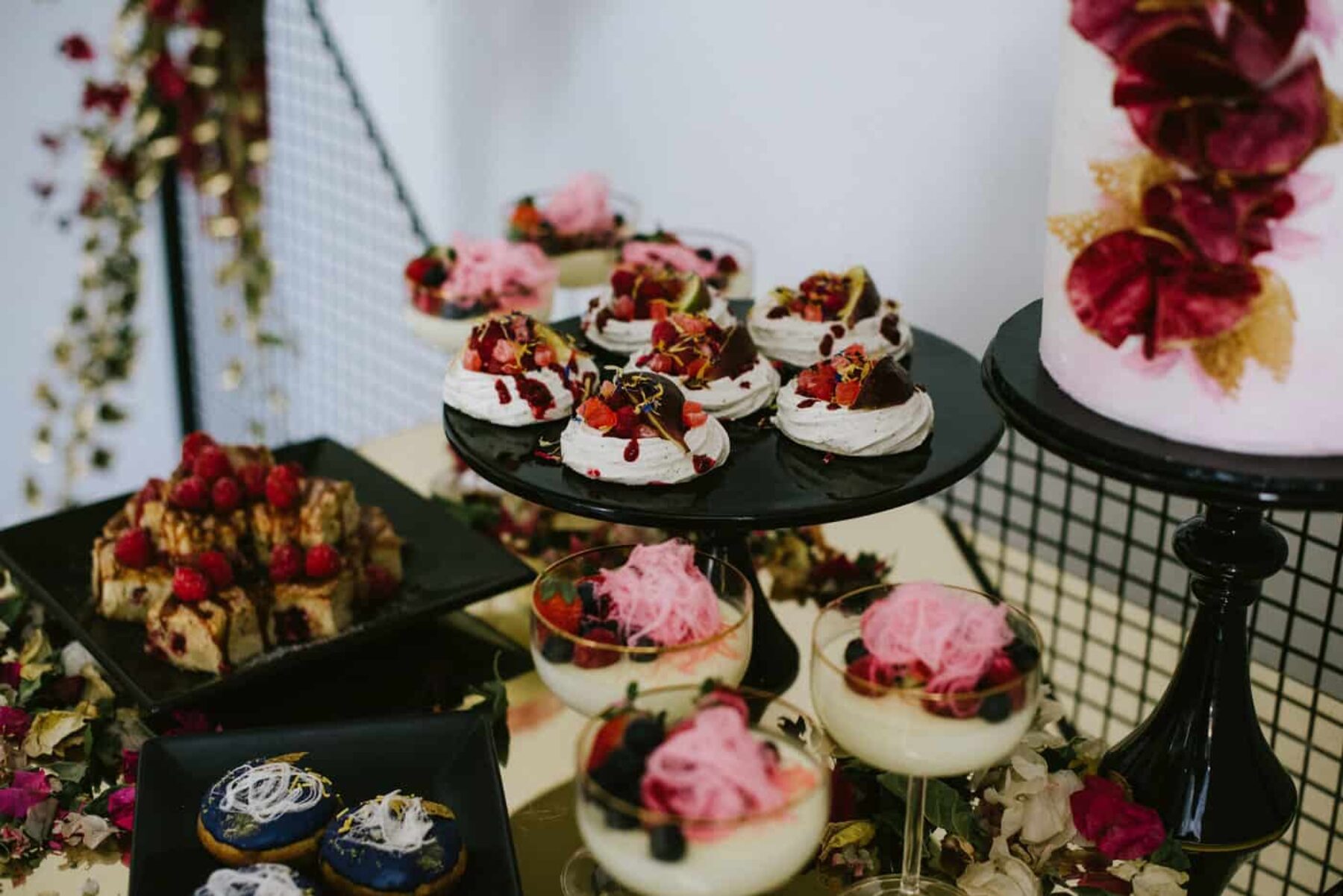 luxe dessert grazing table in rich magenta tones