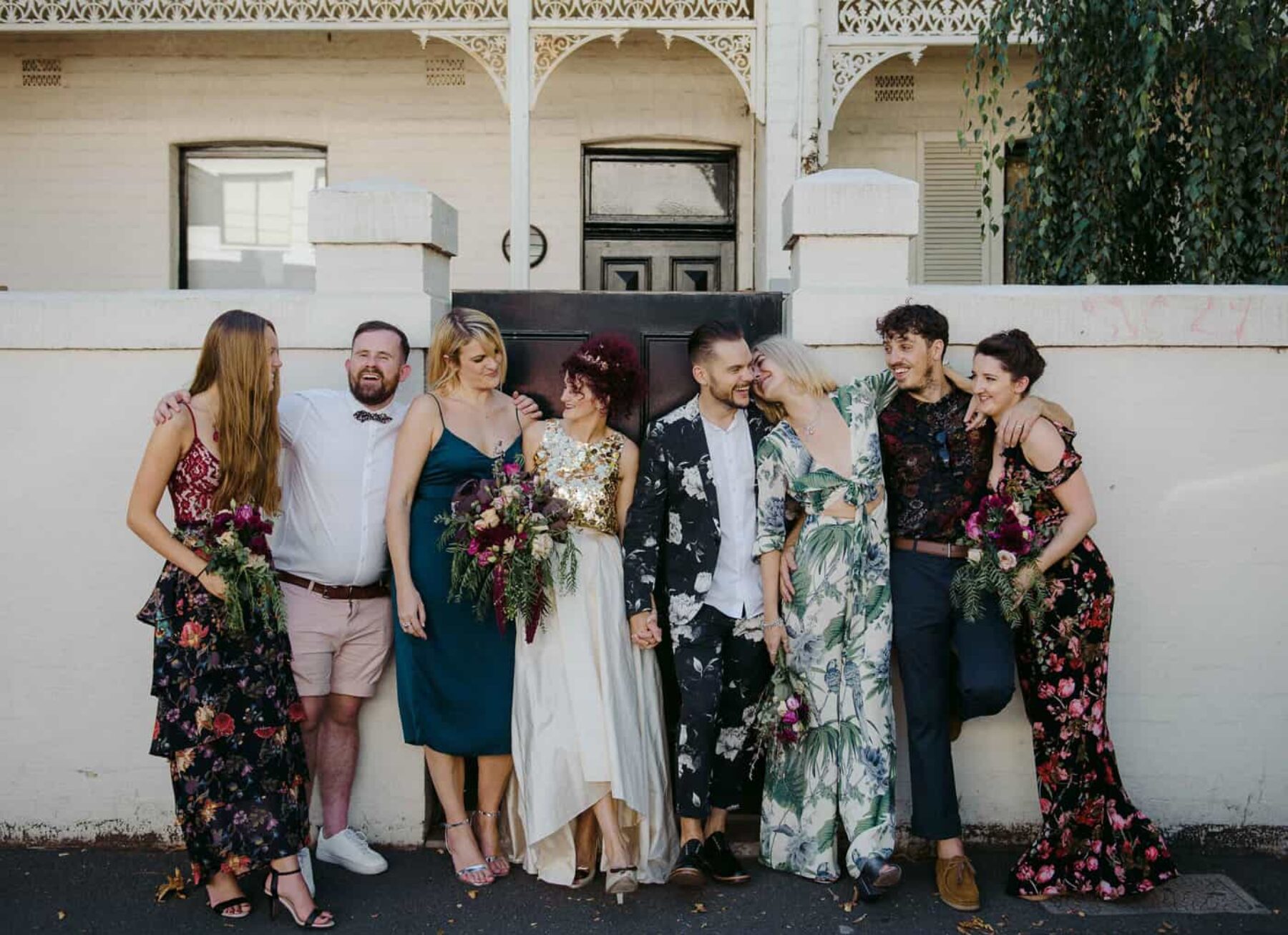 bridemaids in mismatched floral maxi dresses and jumpsuit