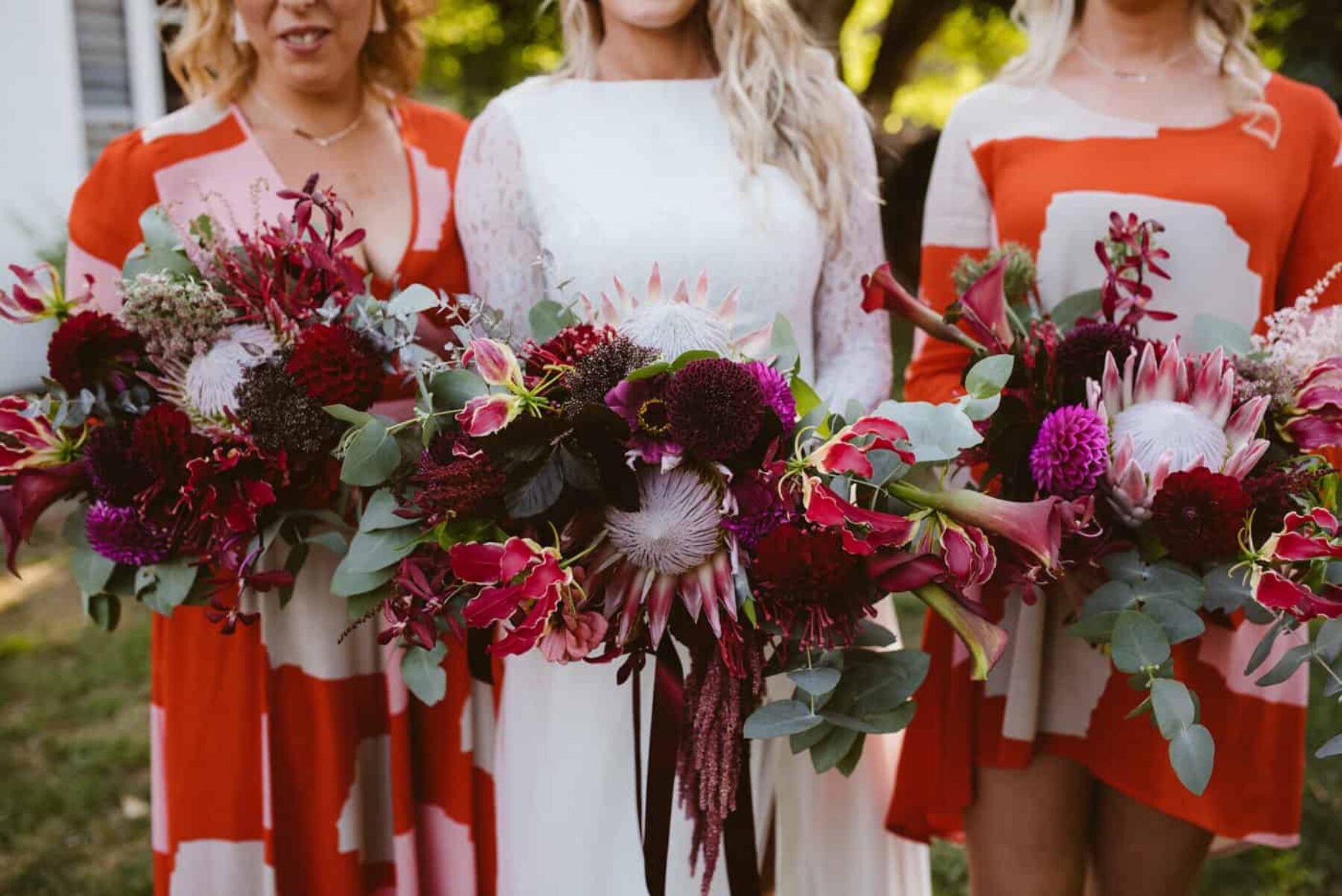 red and burgundy bridesmaid bouquets