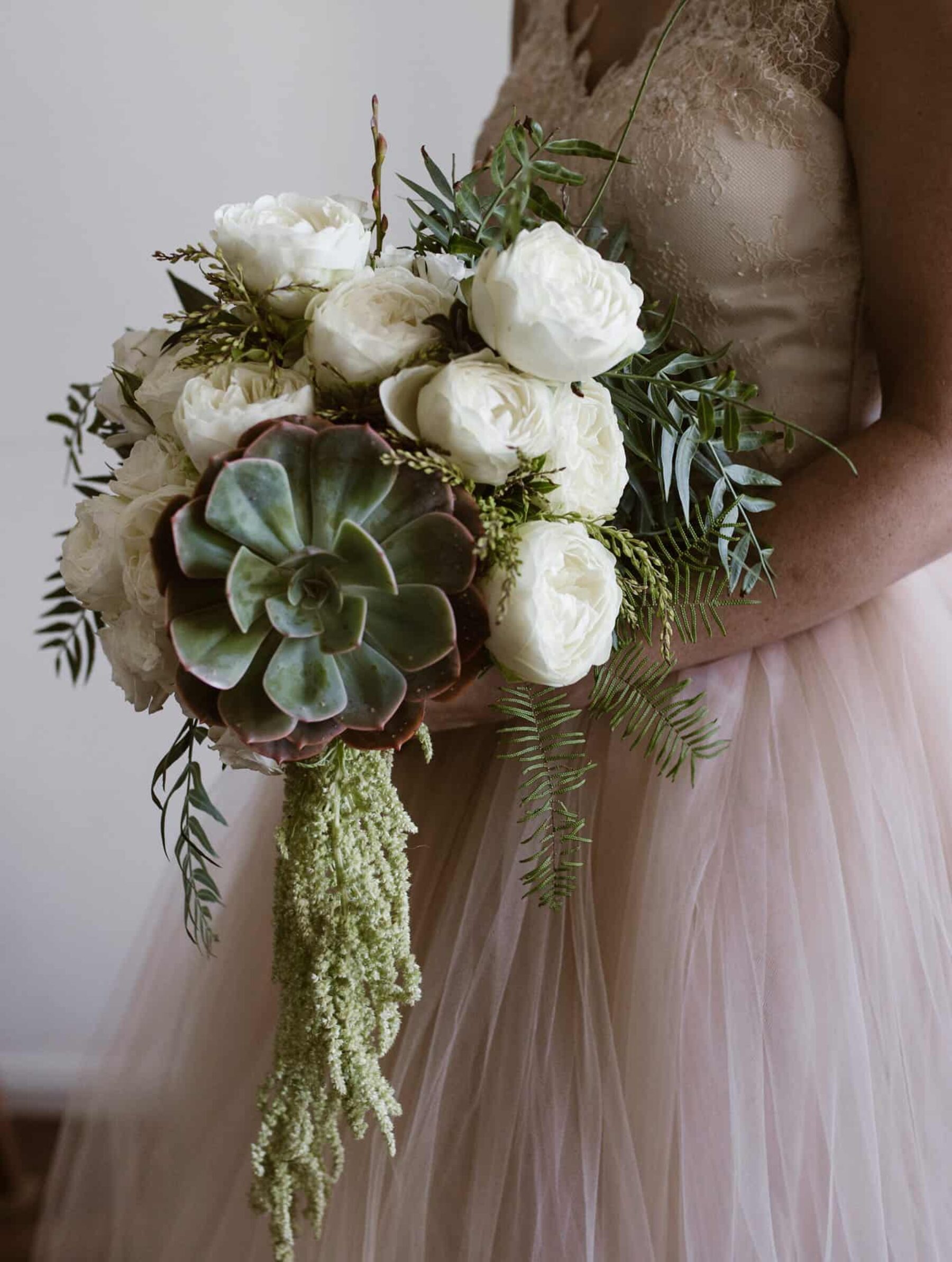 white and green bridal bouquet with succulents