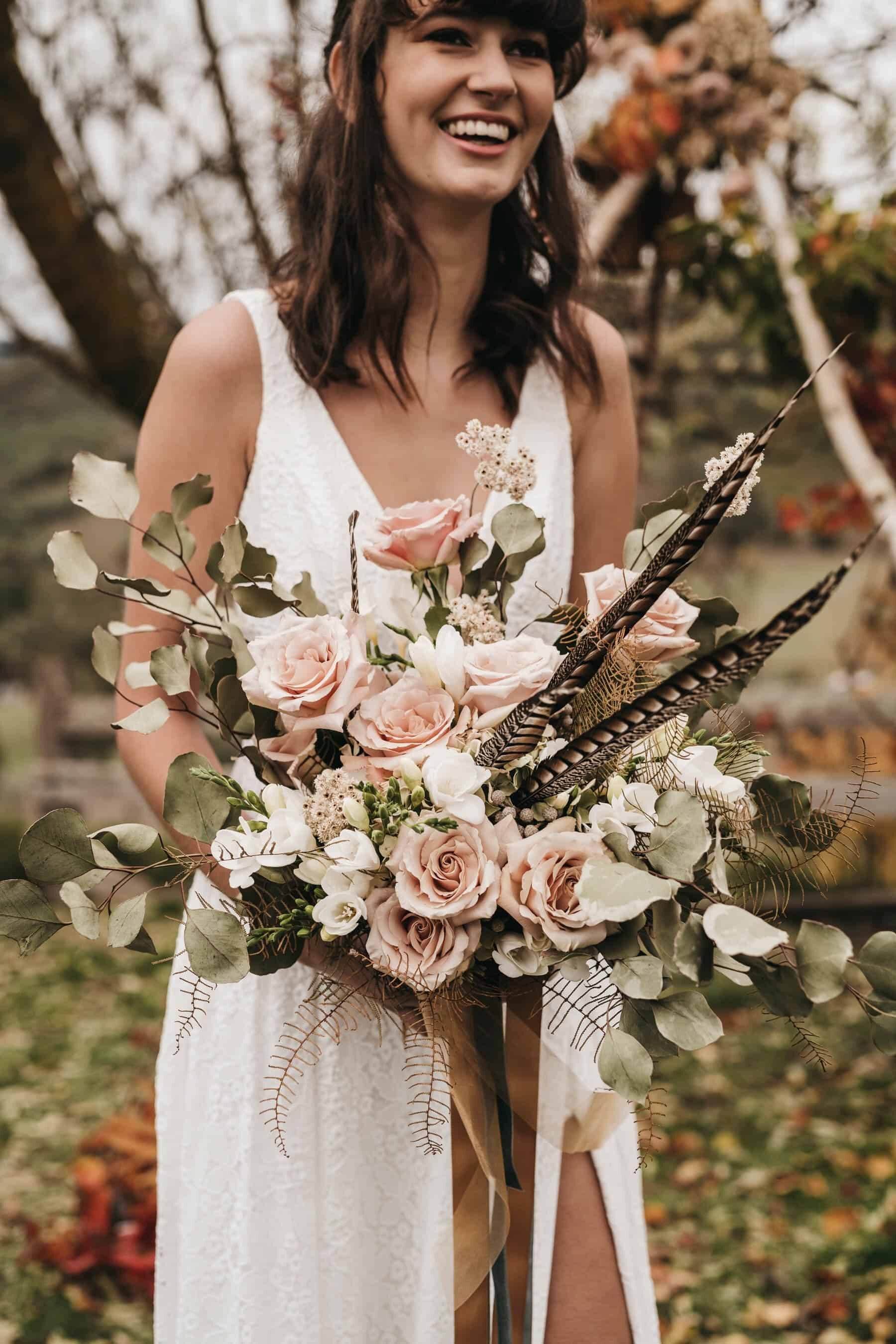 blush bridal bouquet with feathers