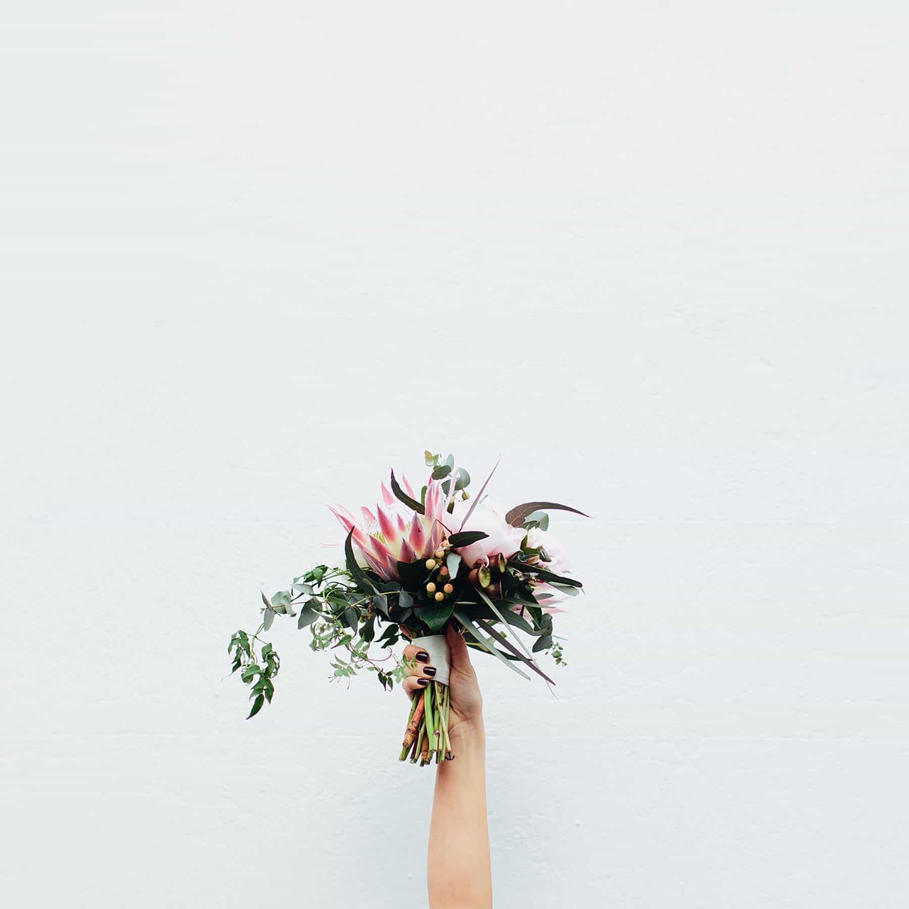 blush bridal bouquet with peonies and proteas