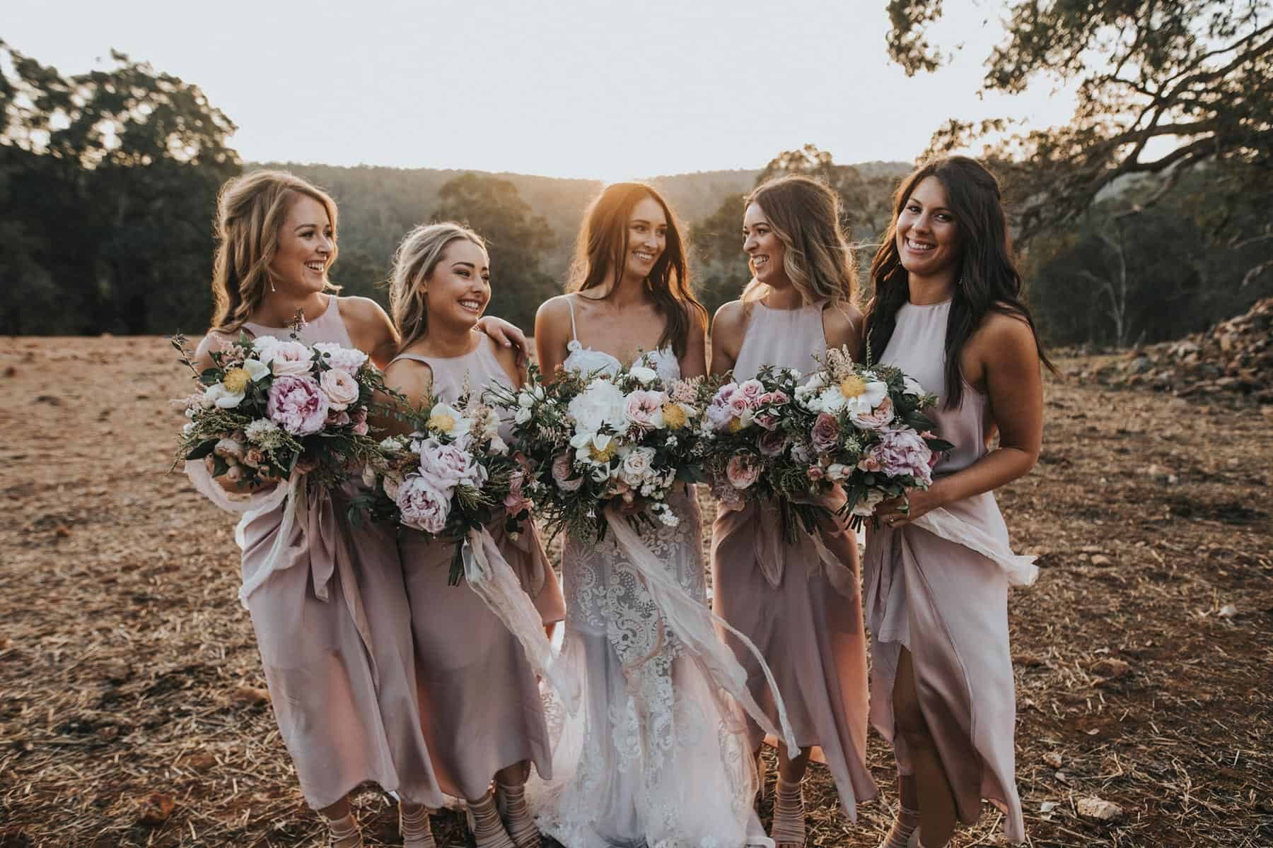 bridesmaids with blush peony bouquets