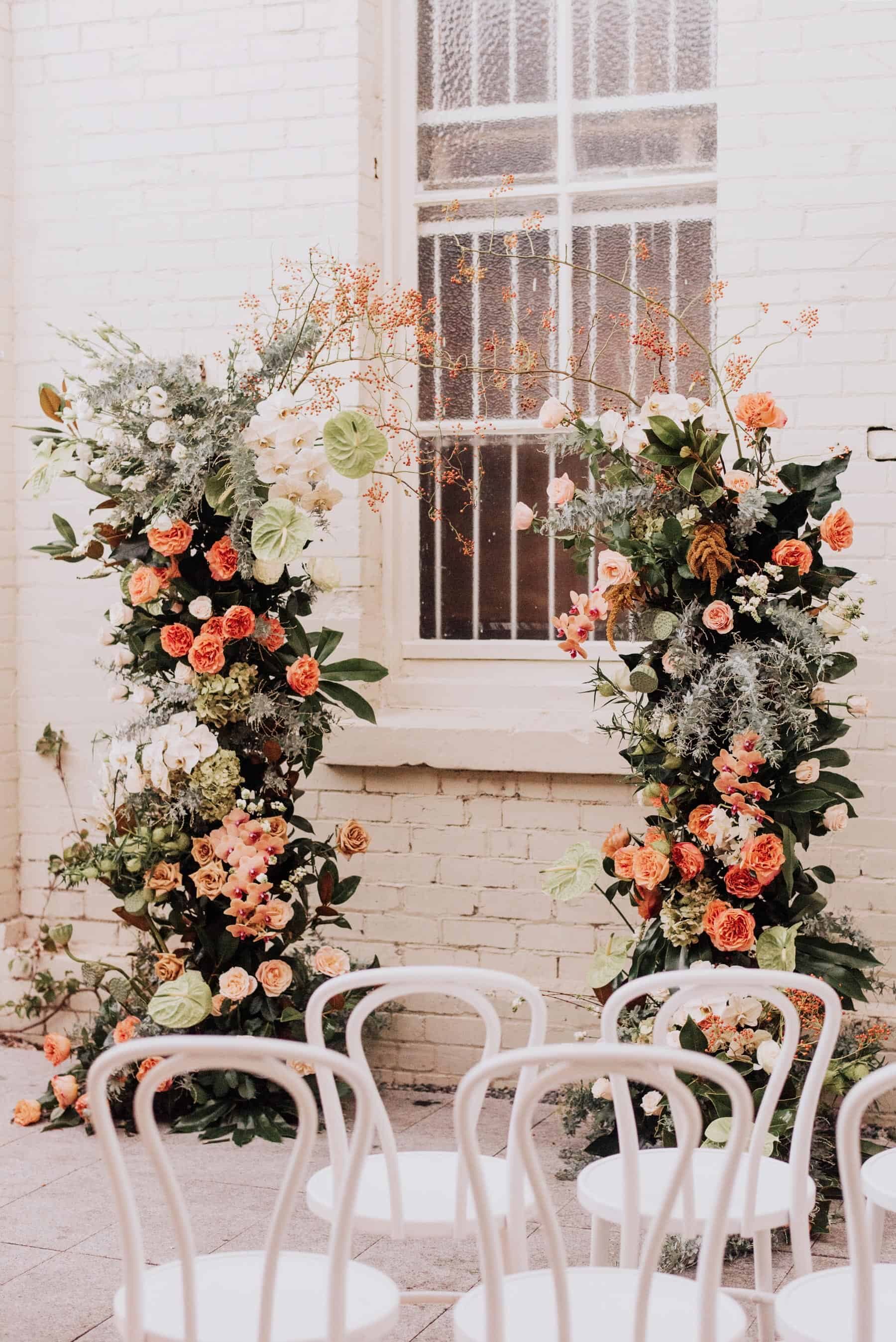 organic peach-toned floral wedding arch