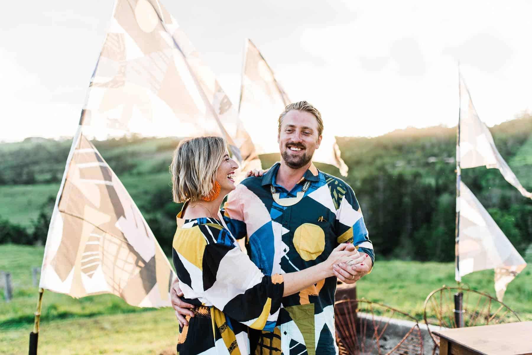 bride and groom in bold graphic prints