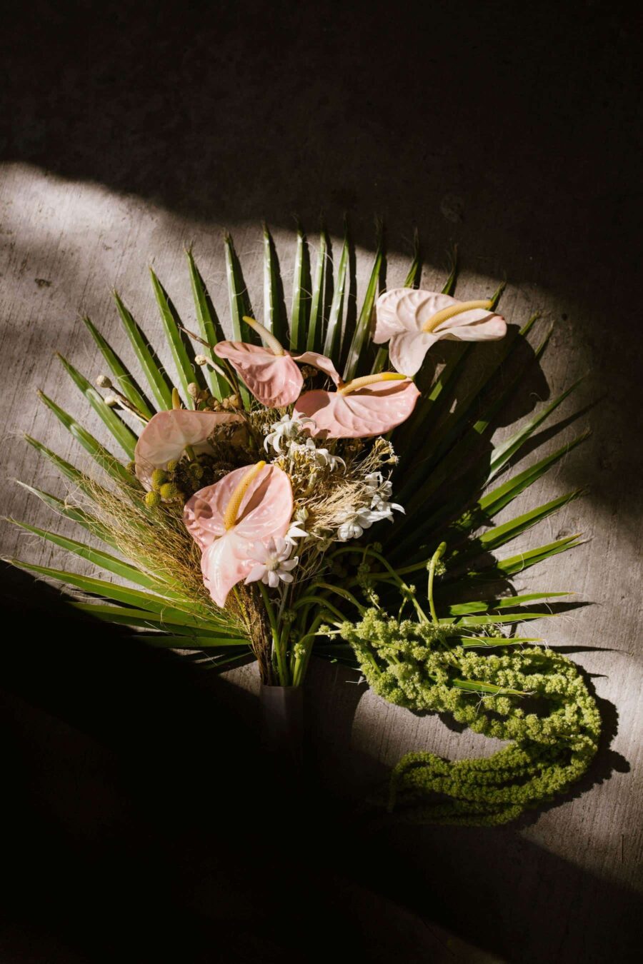 tropical bridal bouquet with blush anthurium laceleaf