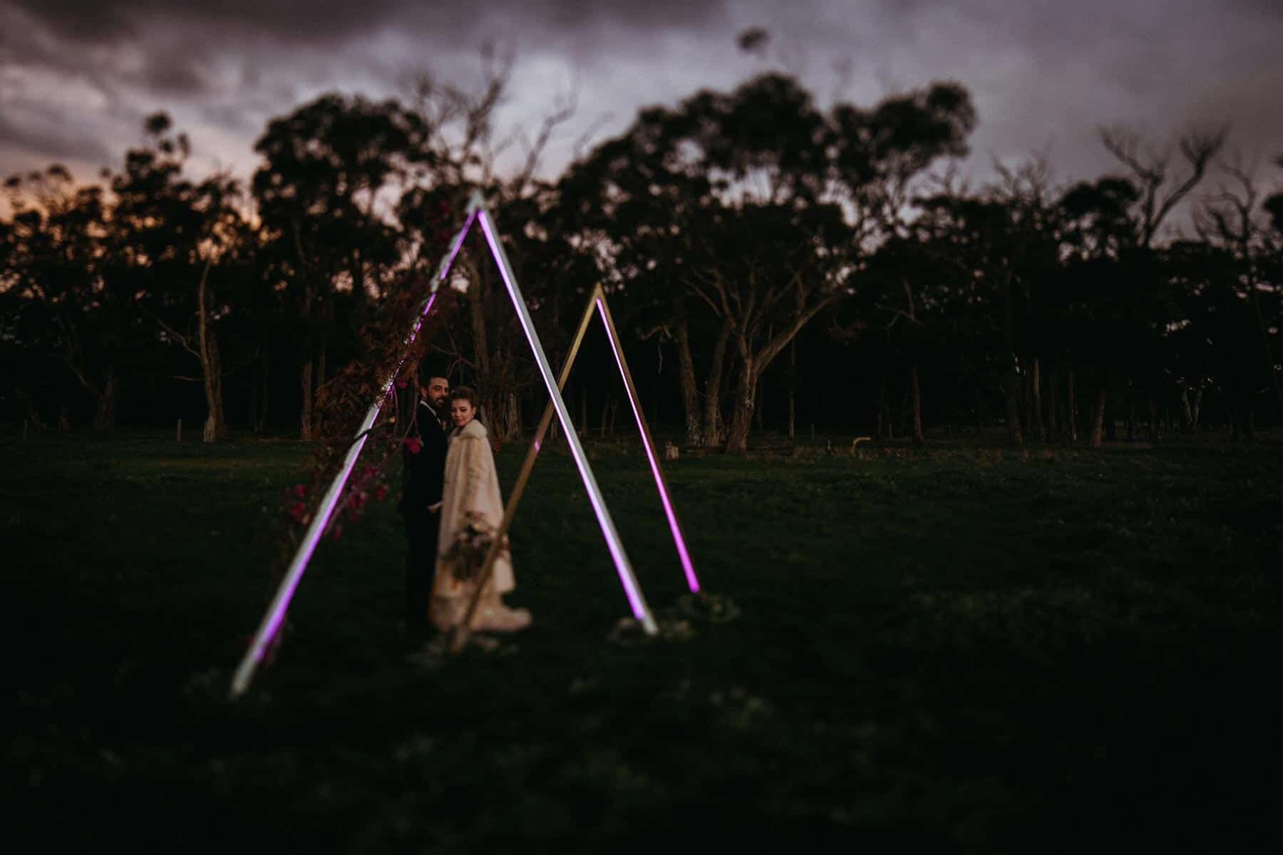 geometric LED illuminated triangle wedding arbours