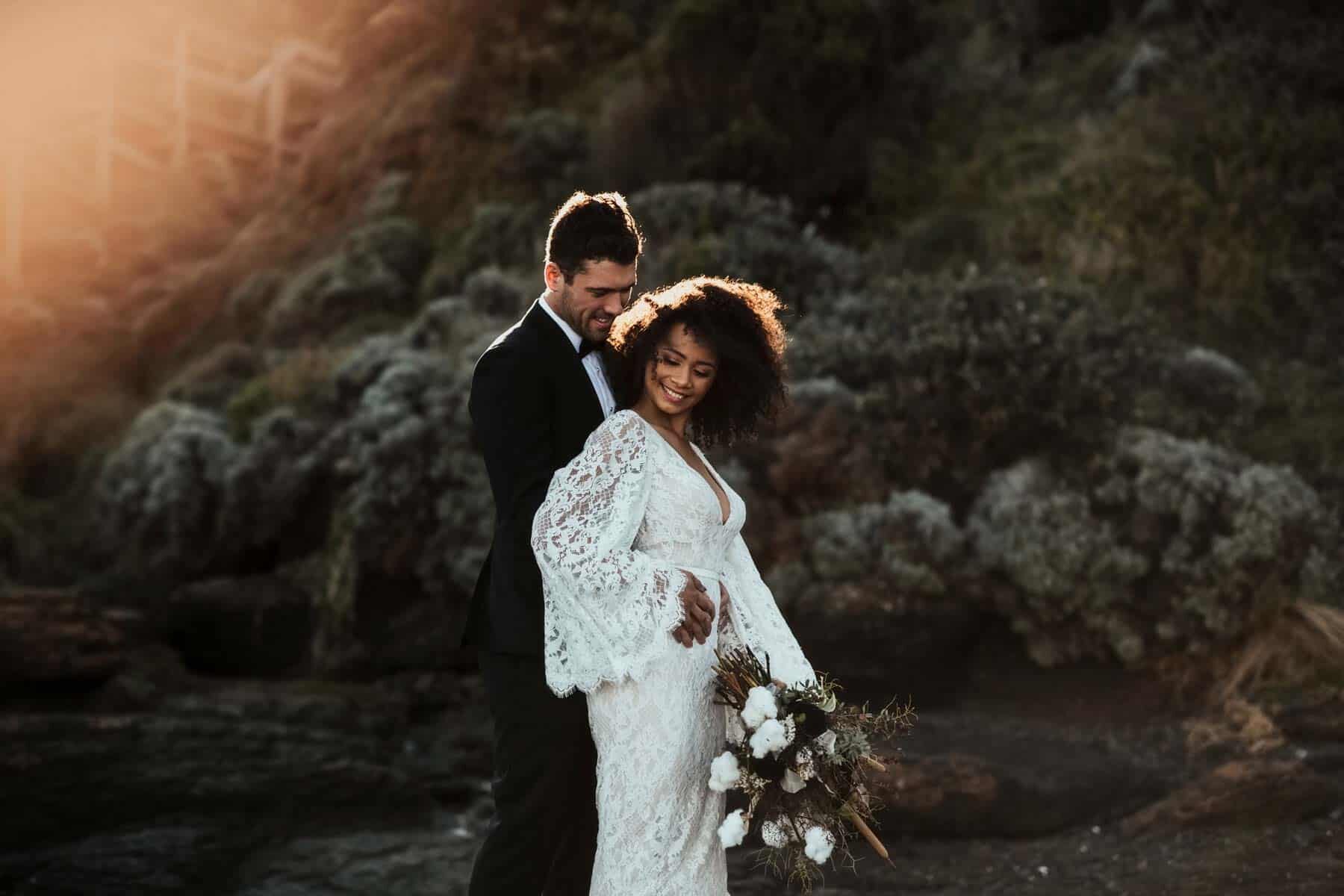 boho bride in lace bell sleeve wedding dress