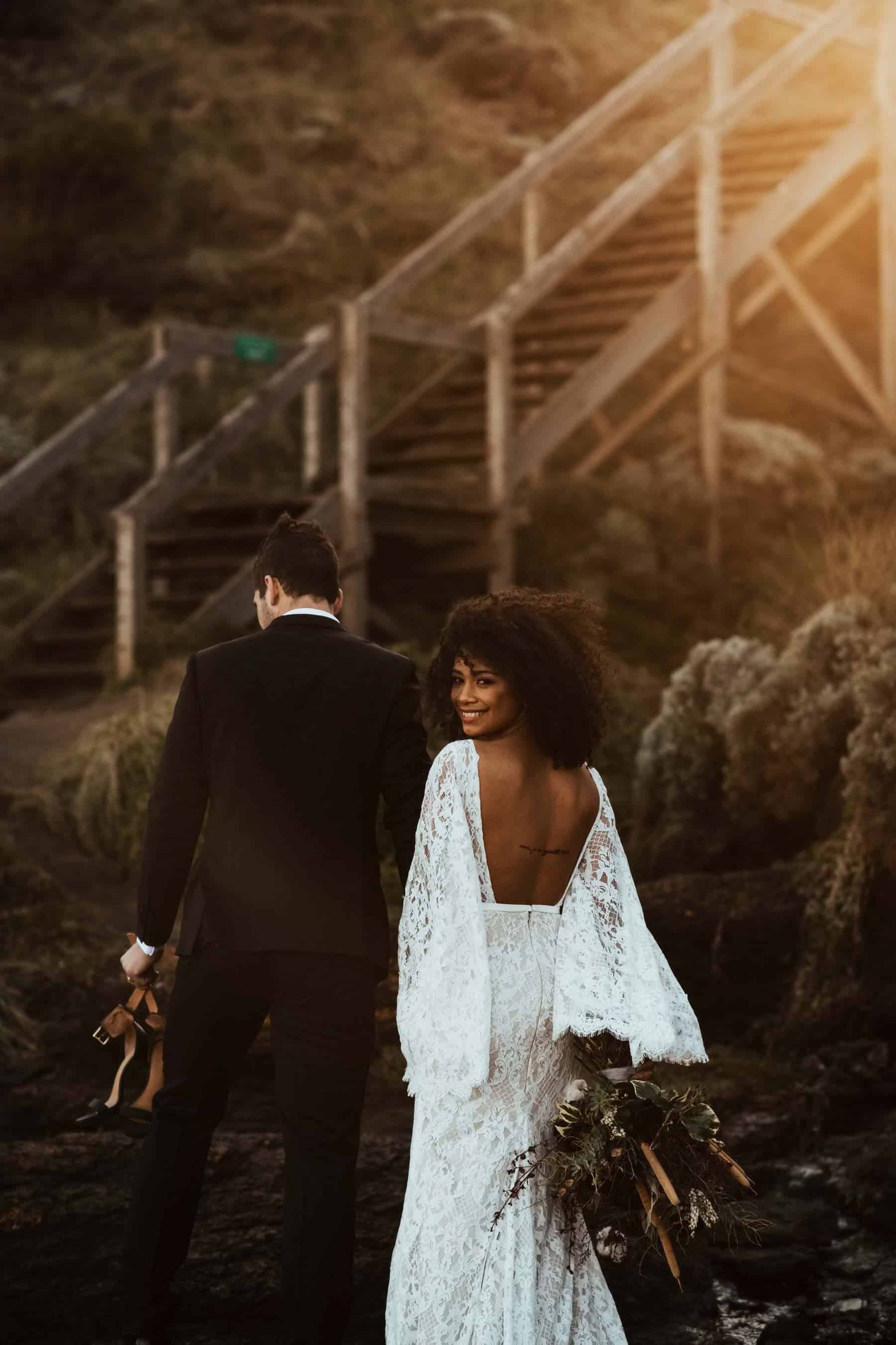 boho bride in backless lace bell sleeve wedding dress