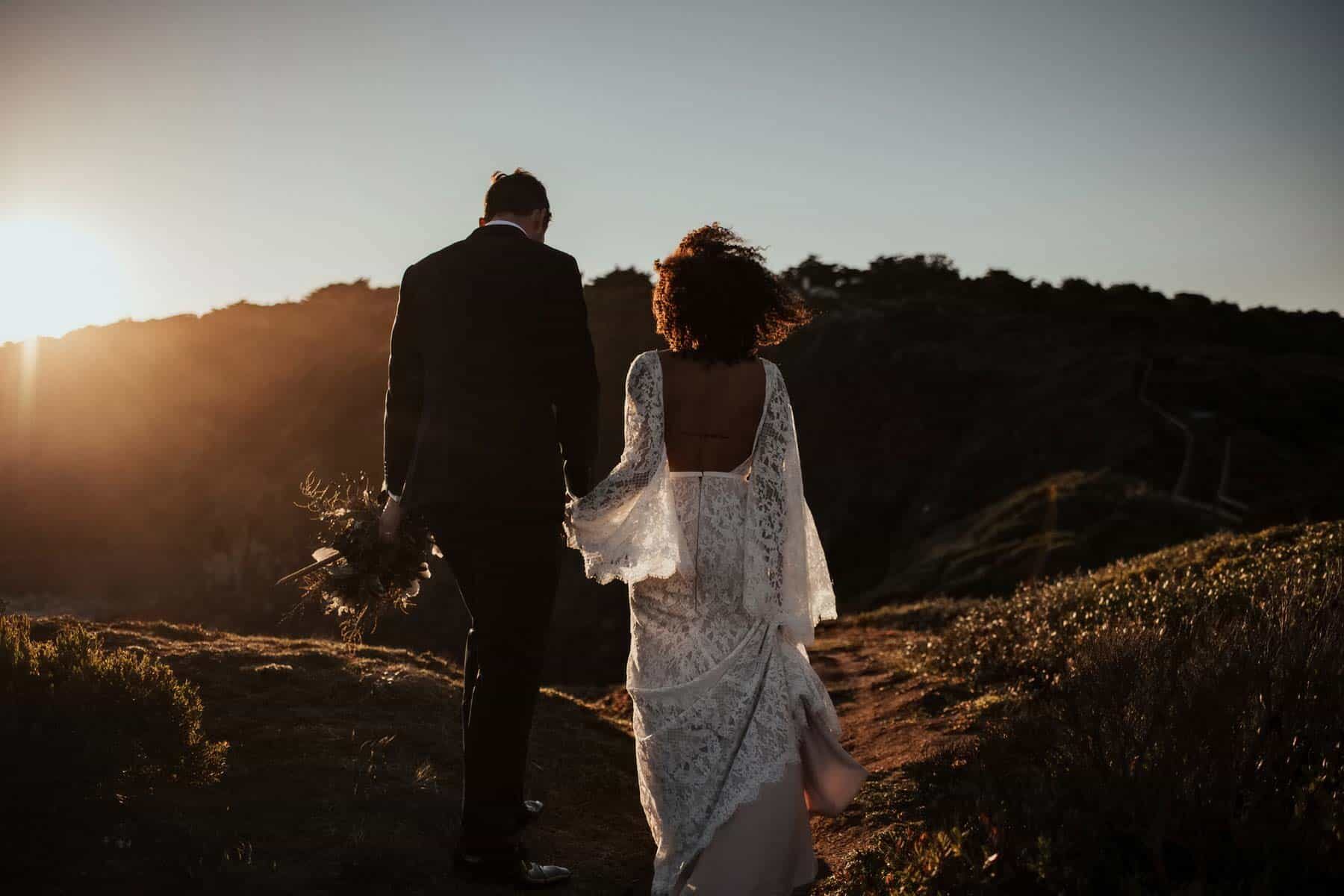 boho bride in backless lace bell sleeve wedding dress