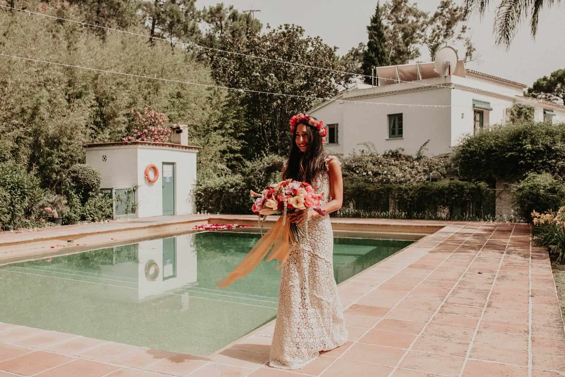 boho bride in two piece crochet wedding dress and Frida Kahlo flower crown