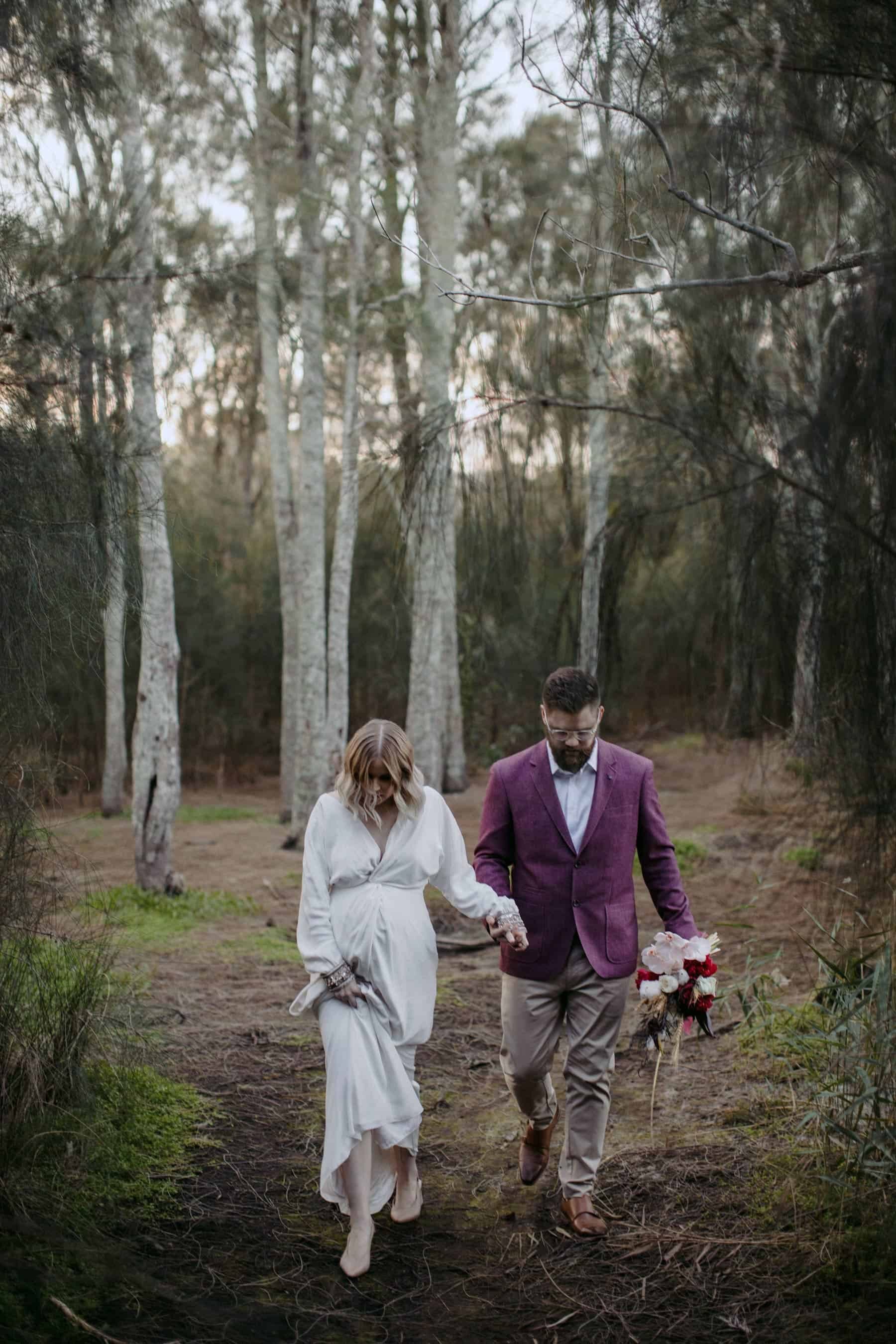 pregnant bride in modern long sleeve wedding dress by Bo & Luca