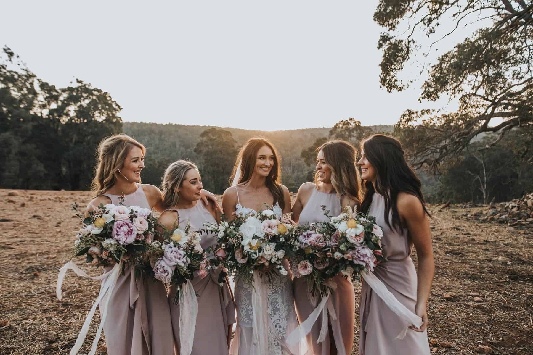 modern blush bridesmaid dresses and wild bouquets