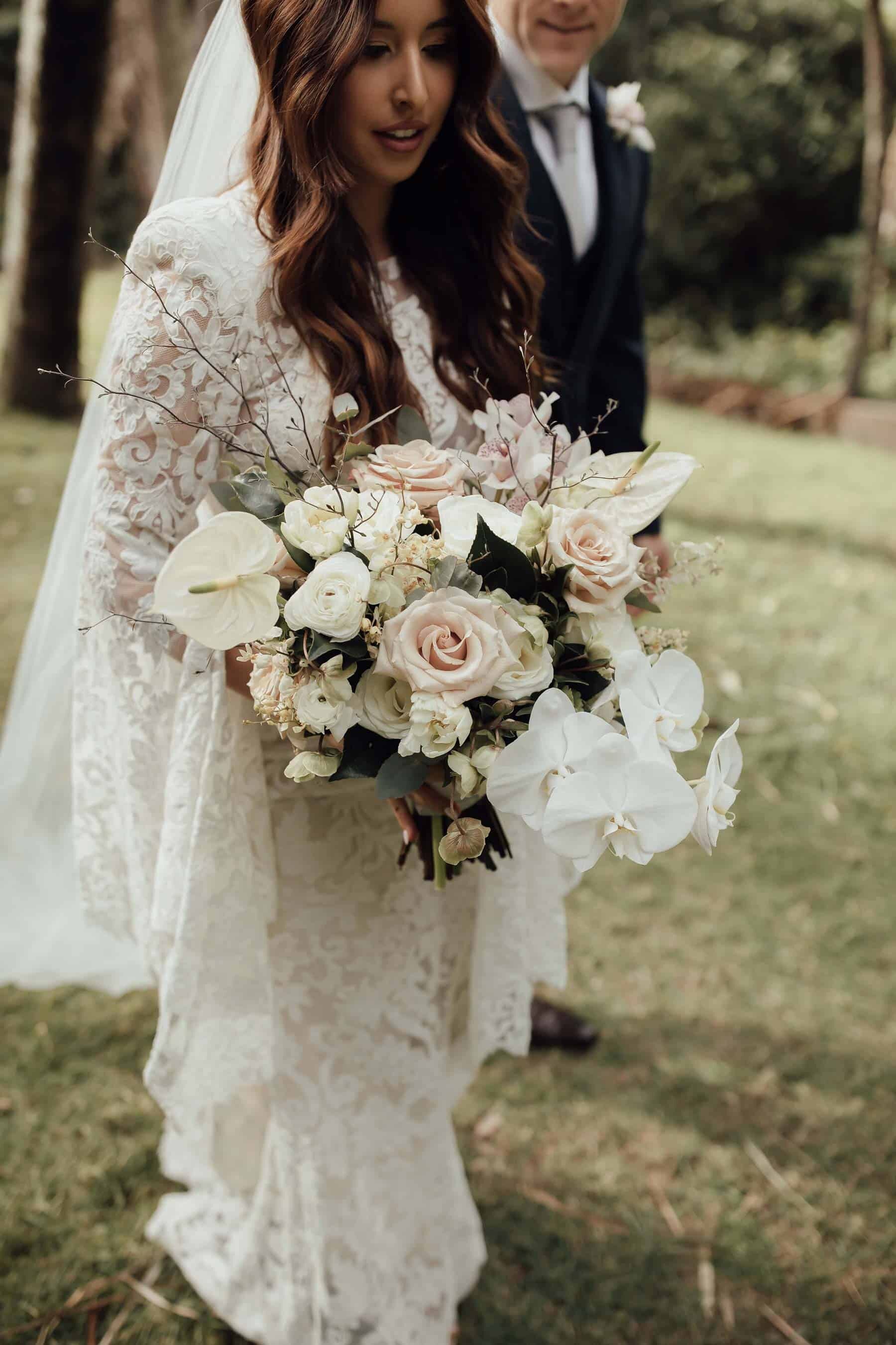 unstructured white and blush bridal bouquet with quicksand roses