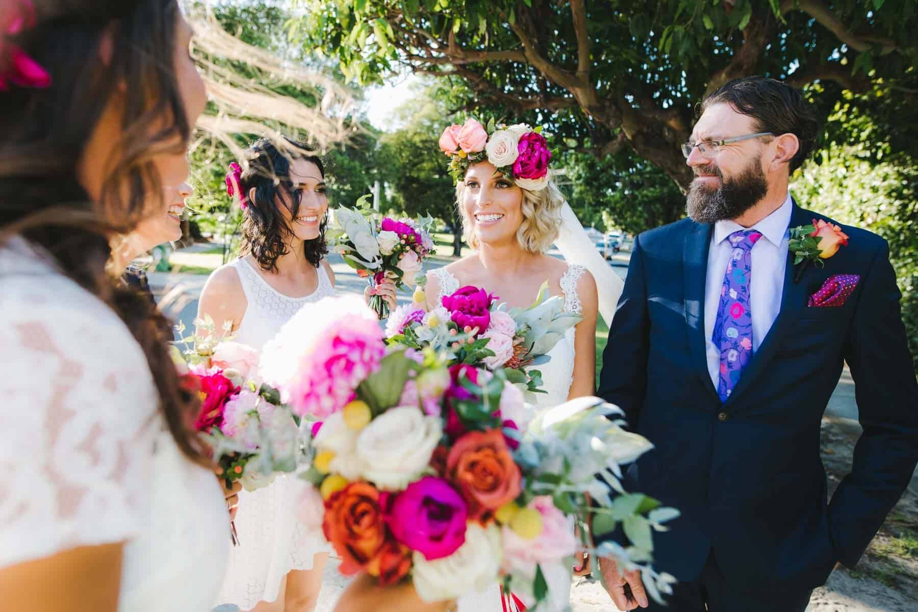bridal party with colourful flower crown and bouquets