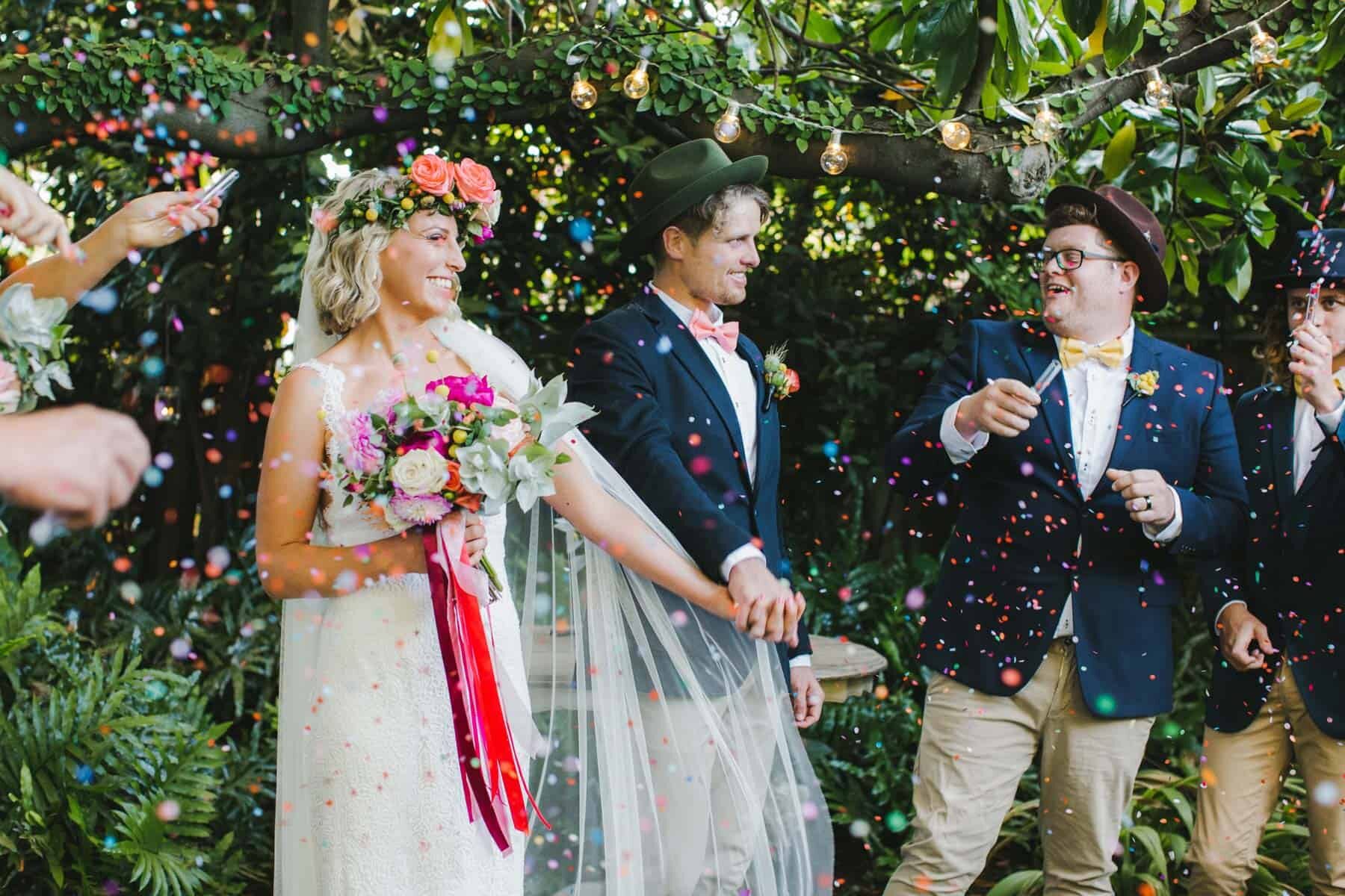 bride wearing colourful flower crown