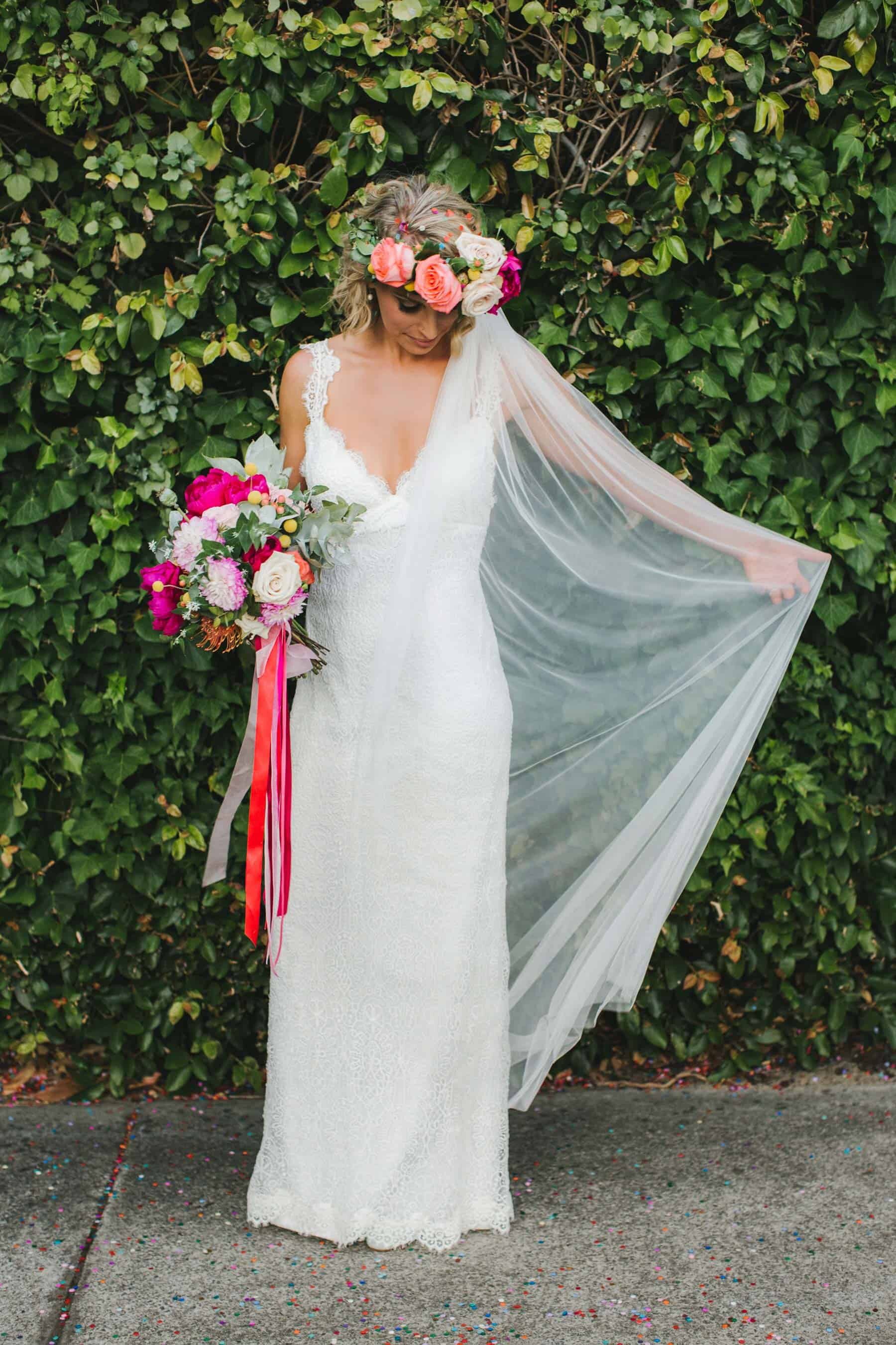 bride with colourful flower crown and bouquet