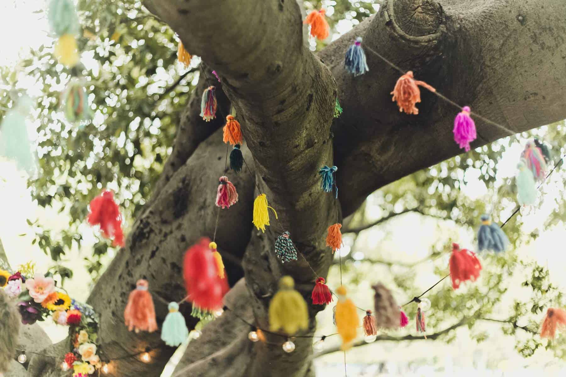 colourful tassels hanging in tree