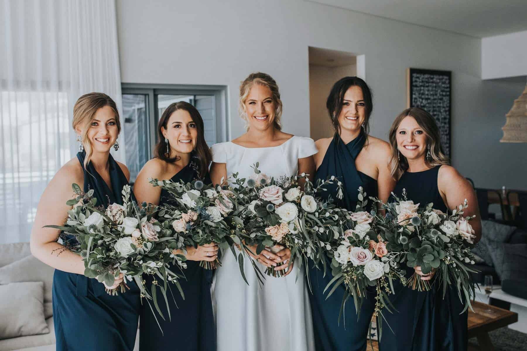 navy blue bridesmaid dresses blush bouquets
