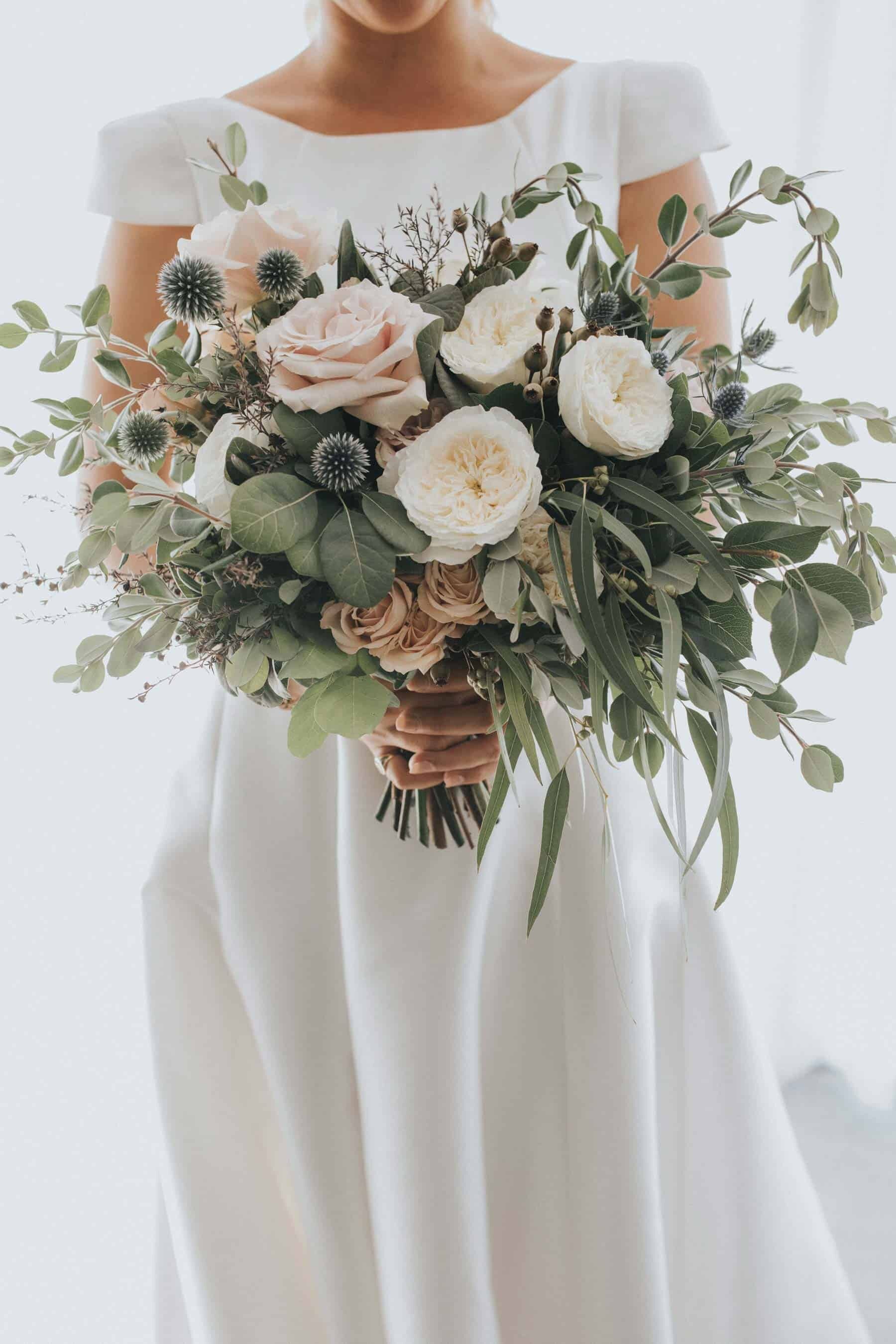 blush and sage bridal bouquet with quicksand roses and thistle