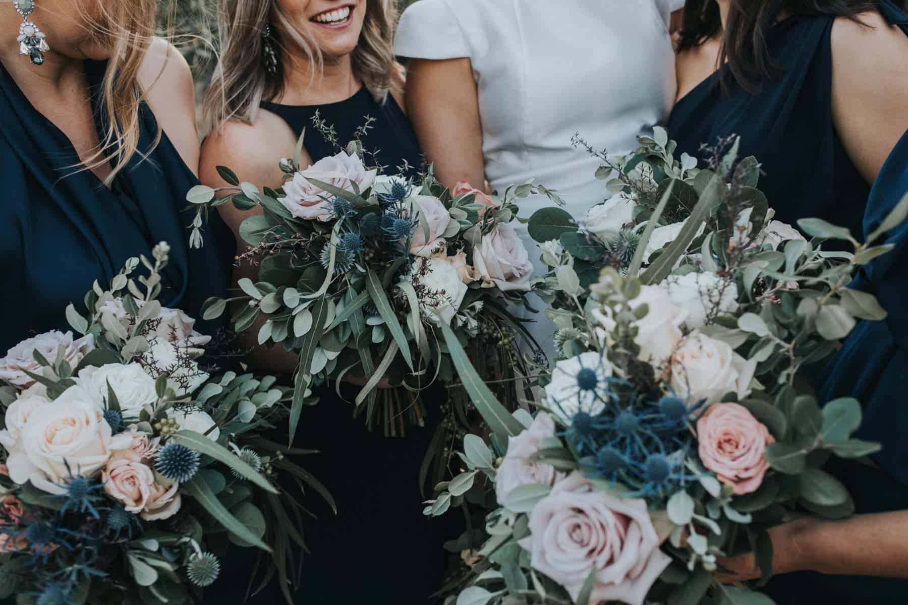blush and sage bridesmaid bouquets with quicksand roses and thistle