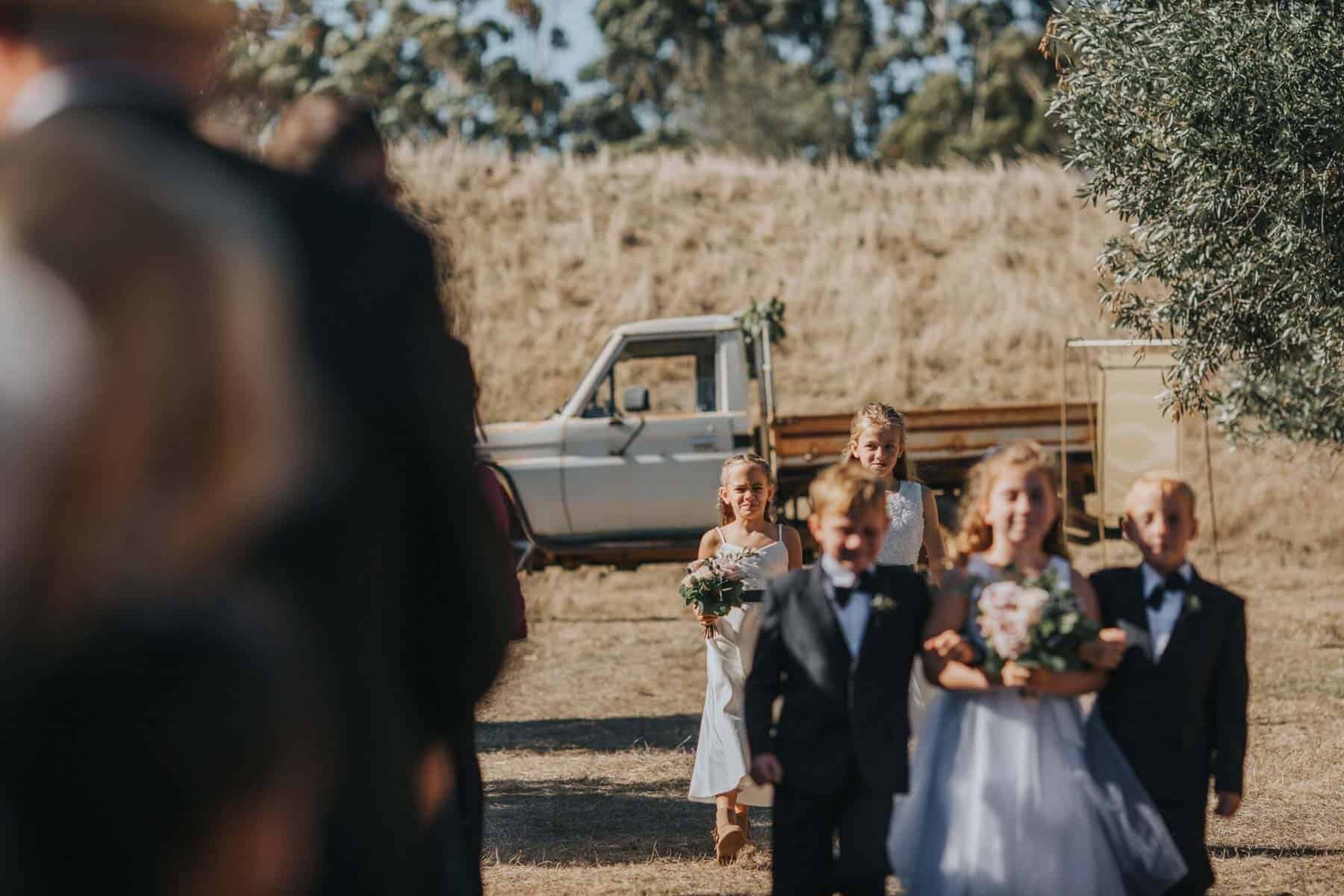 flower girls and page boys on an old ute - Australian wedding