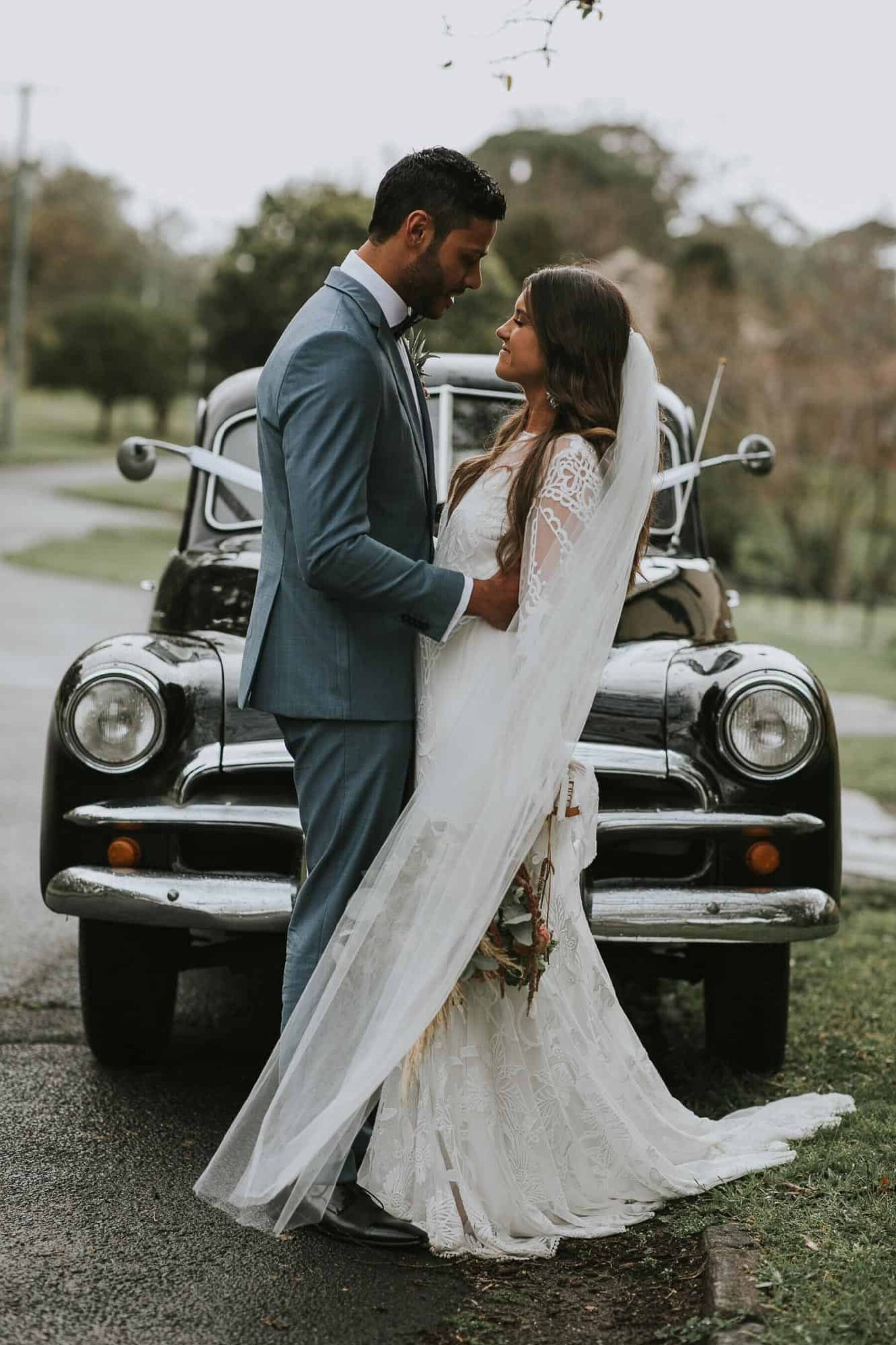 boho bride in long sleeve lace wedding dress by Rue de Seine