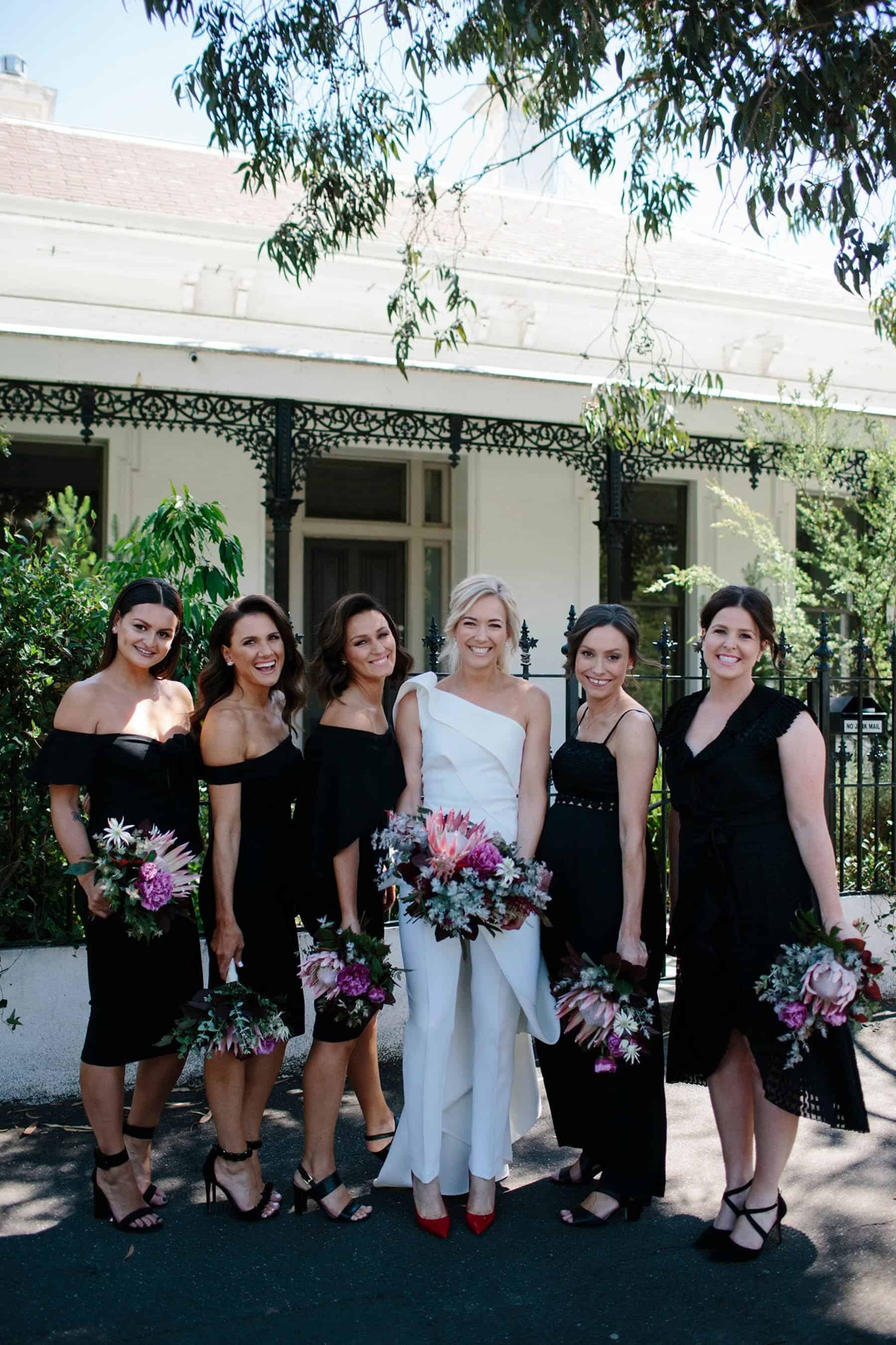 modern bridal party with the bride in a jumpsuit
