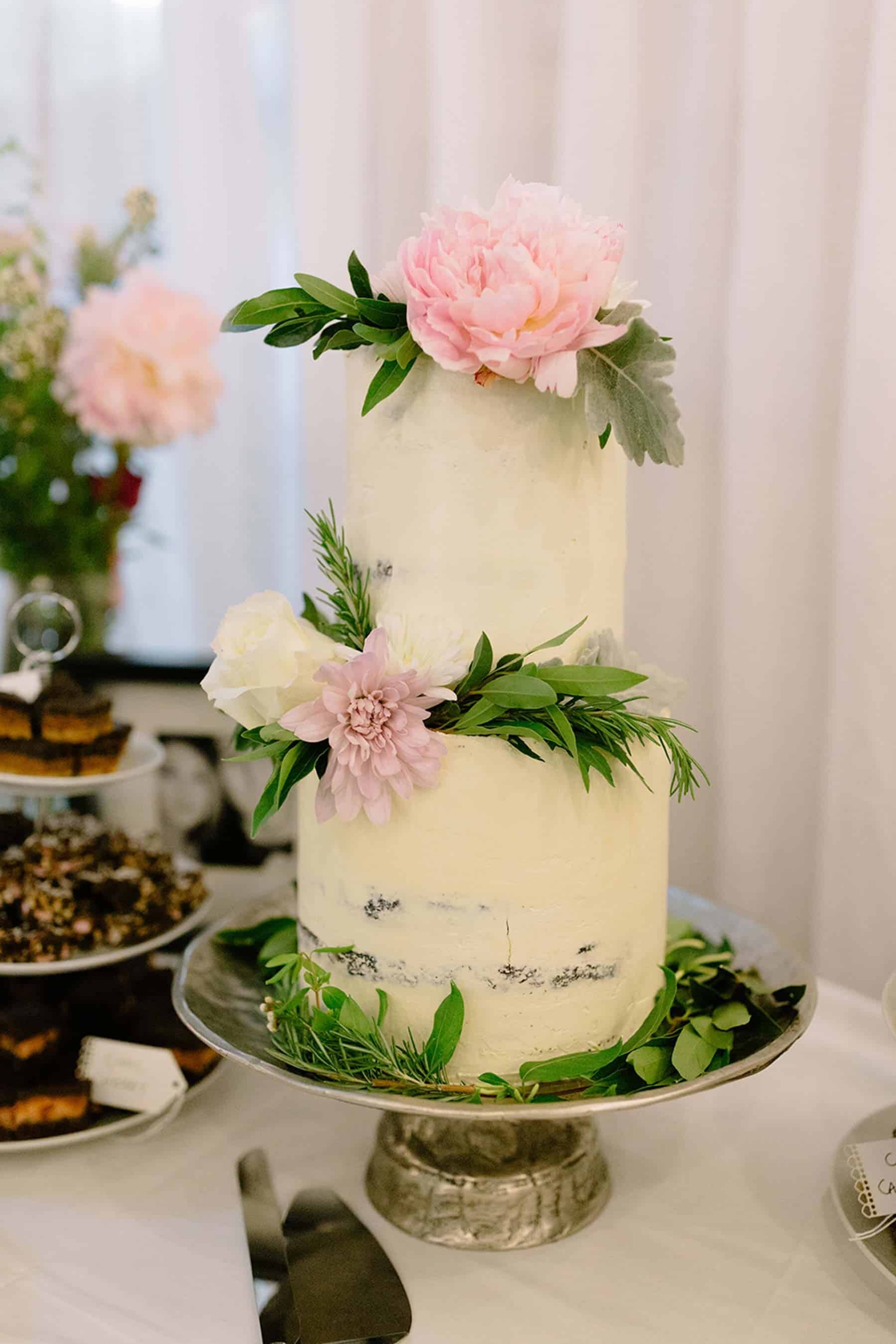 simple wedding cake with fresh flowers