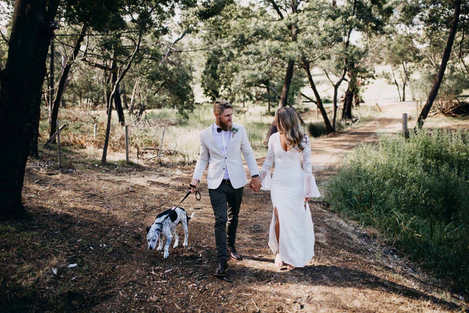 boho wedding with puppy in bow tie