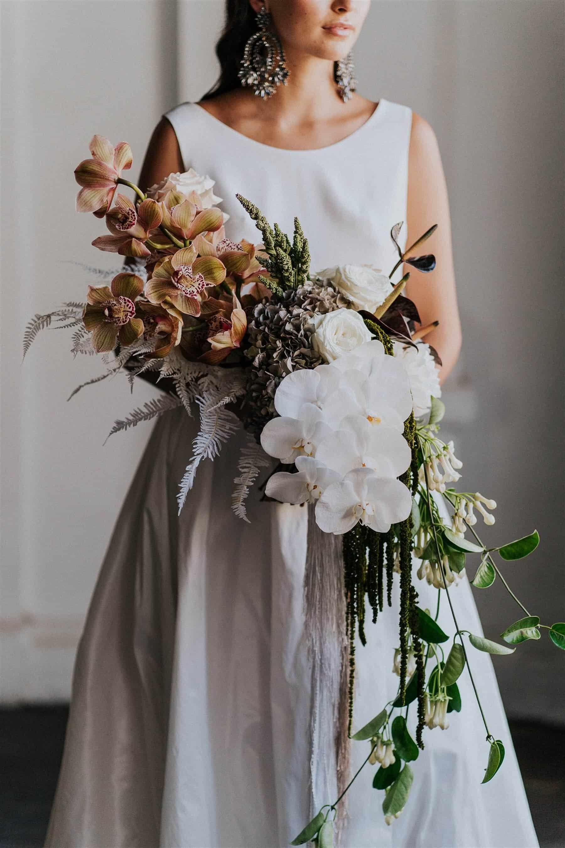 modern cascading bridal bouquet with orchids
