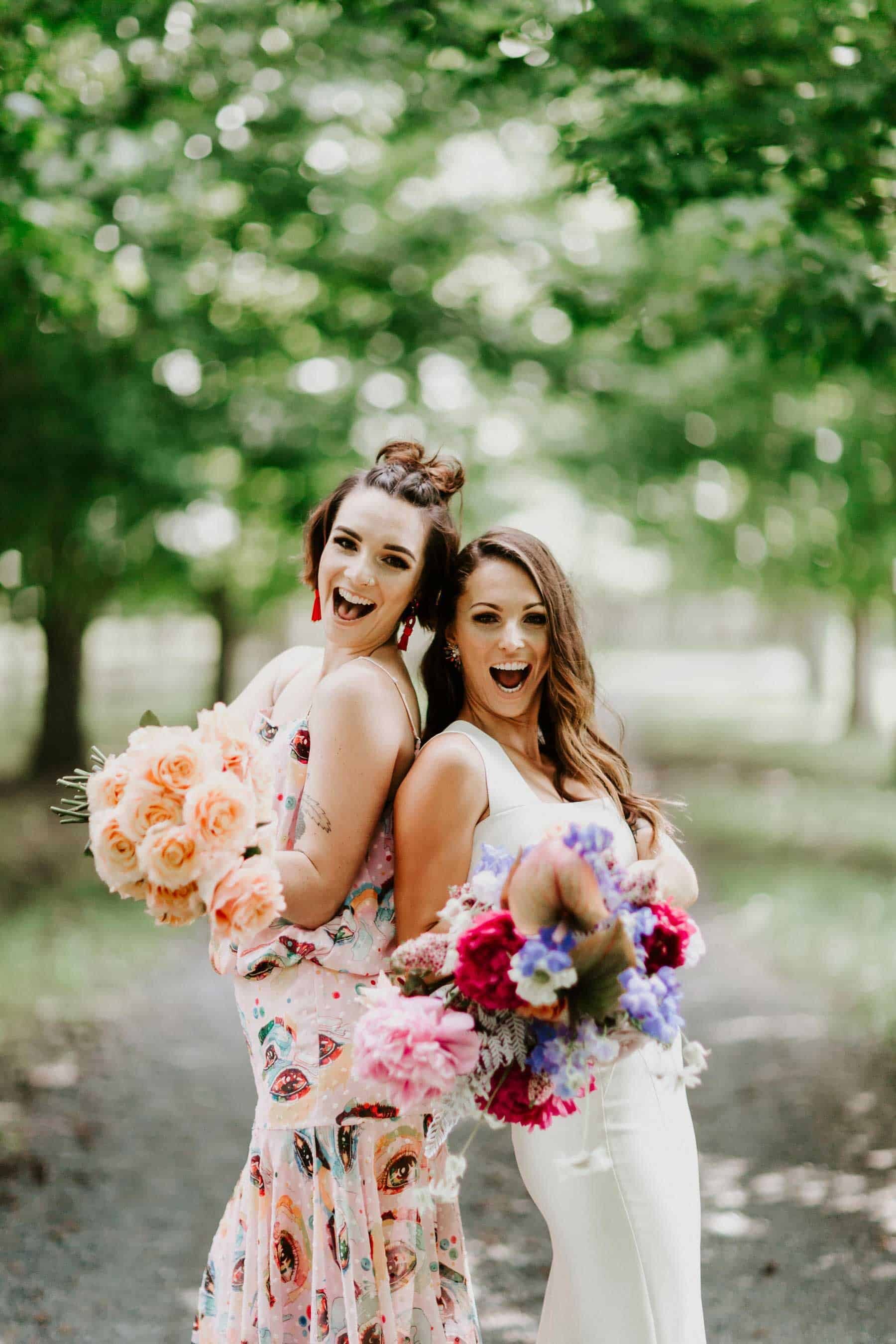 bride and bridesmaid with colourful bouquets